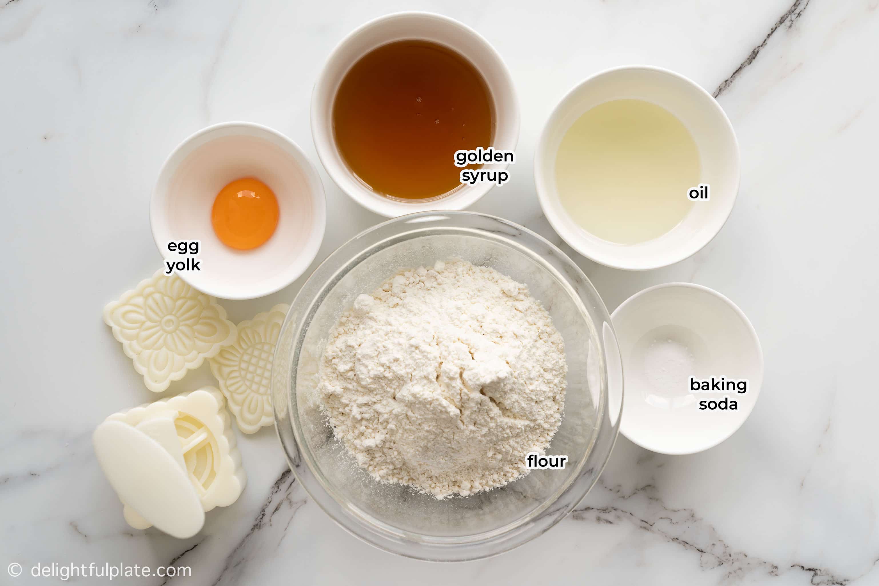 bowls containing ingredients for mooncake dough