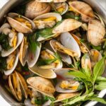 a skillet of steamed clams with Thai Basil and lemongrass