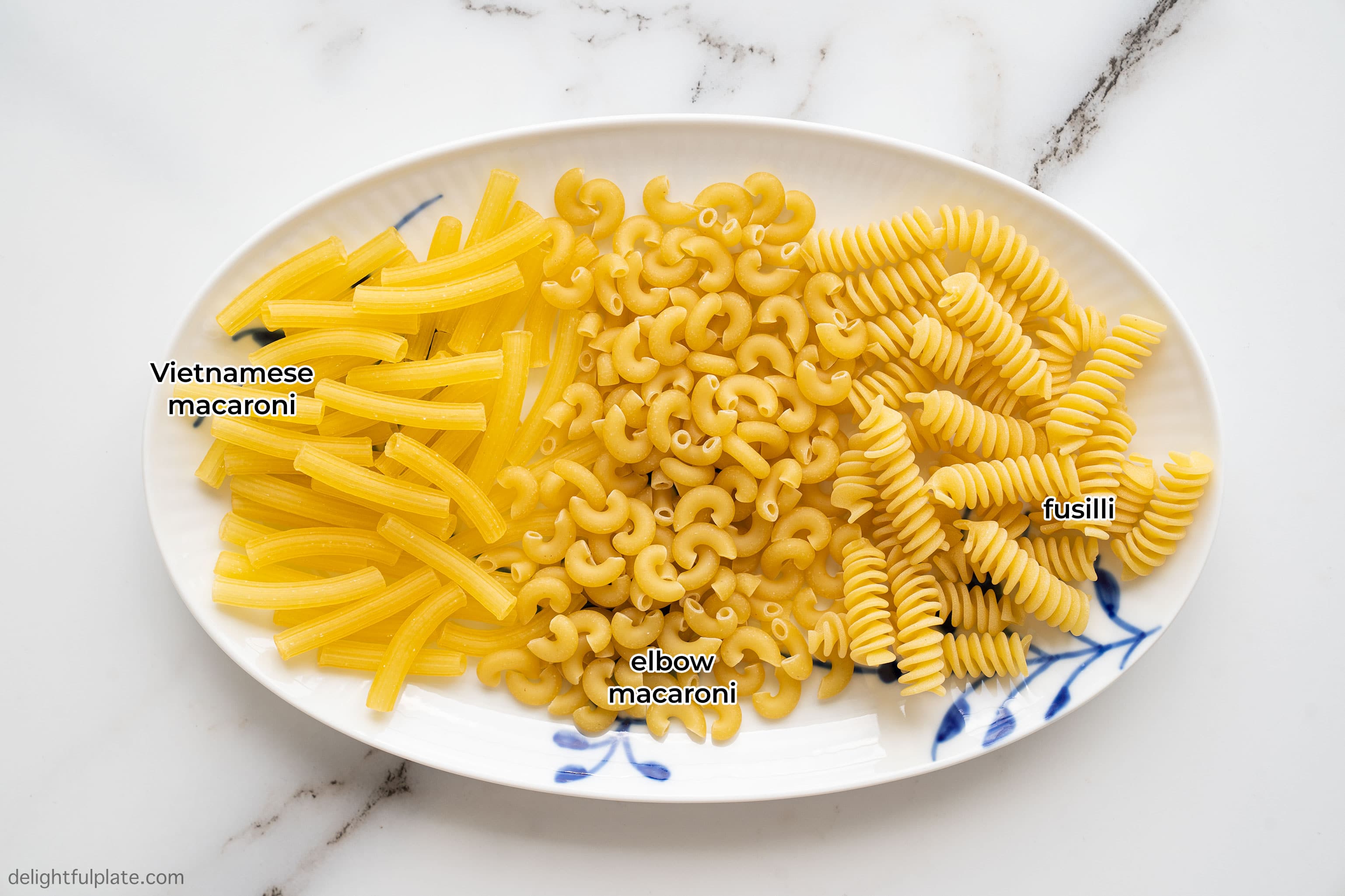 a plate with 3 types of pasta: Vietnamese macaroni, elbow macaroni and fusilli