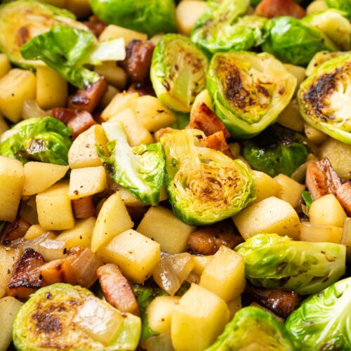 a pan of Sautéed Brussels Sprouts with Bacon and apple