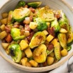 a bowl of sautéed Brussels sprouts, bacon and apple