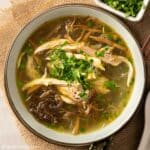 a bowl of Vietnamese chicken glass noodle soup with bamboo shoots
