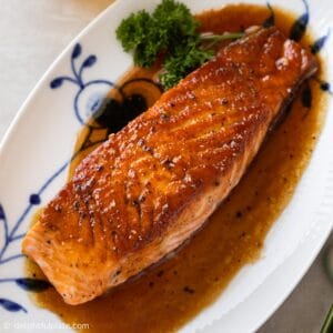 a glazed salmon fillet on a serving plate
