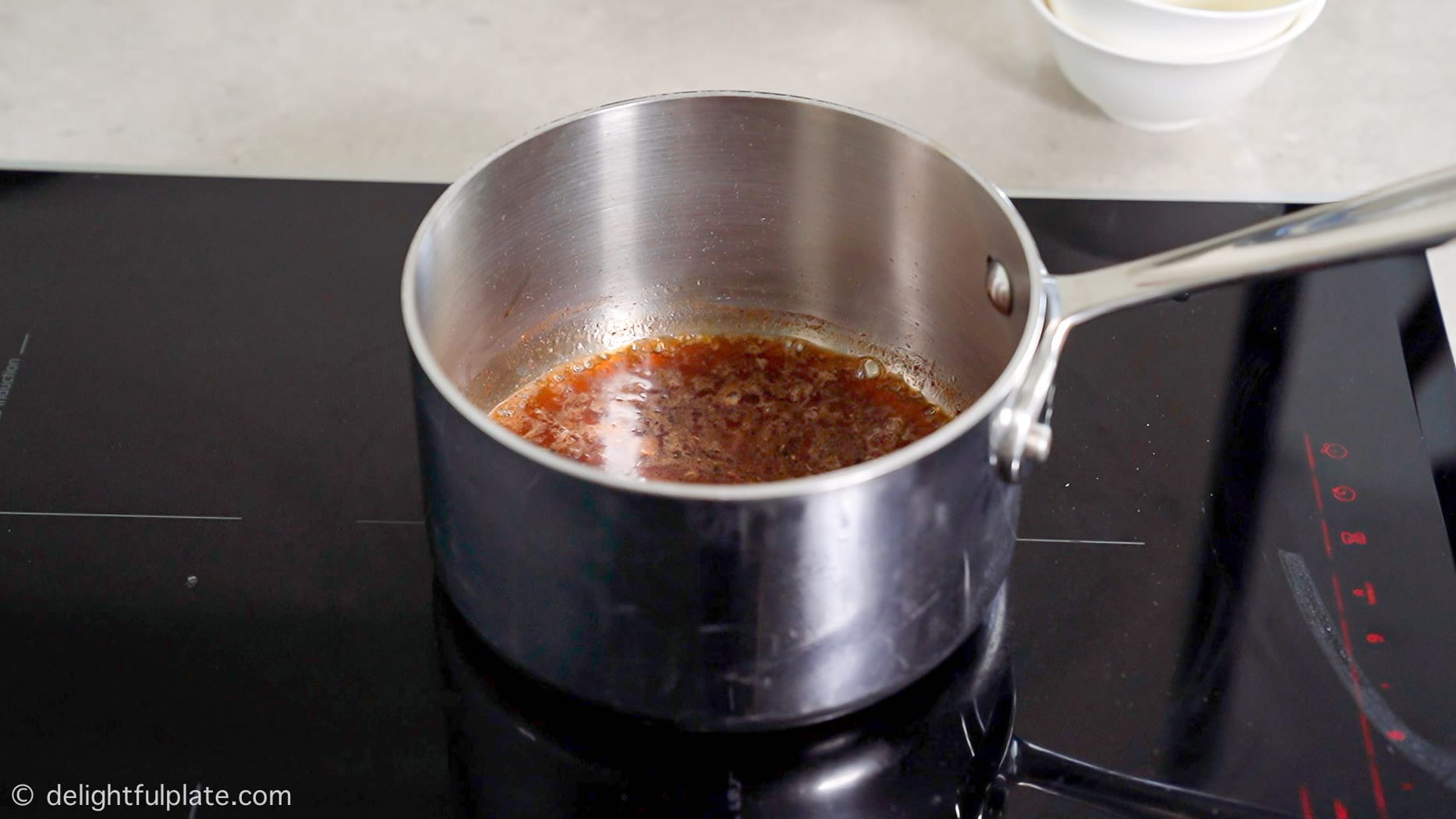 simmer the glaze for salmon in a pot