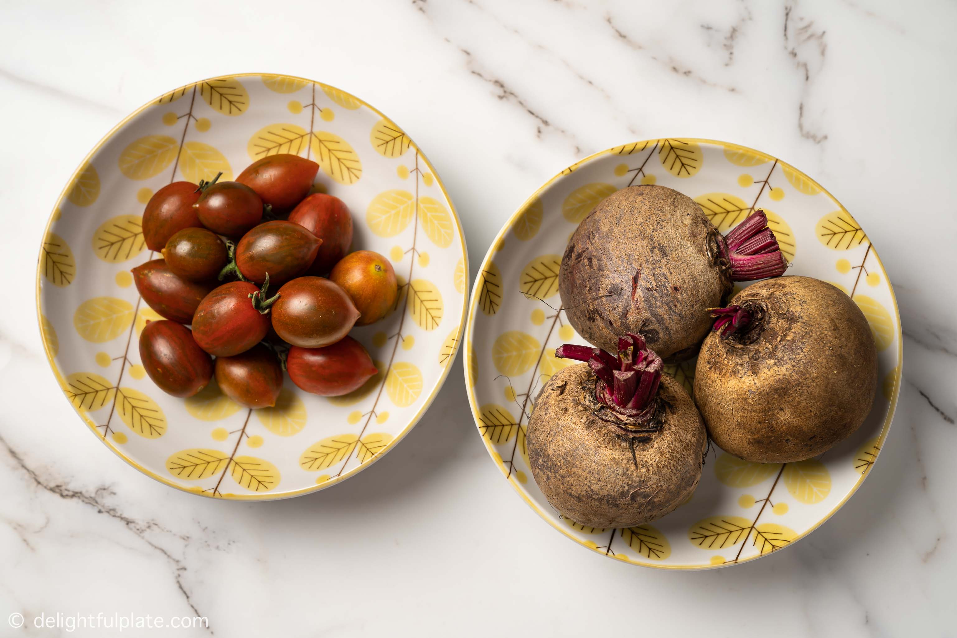 plates with beetroots and cherry tomatoes