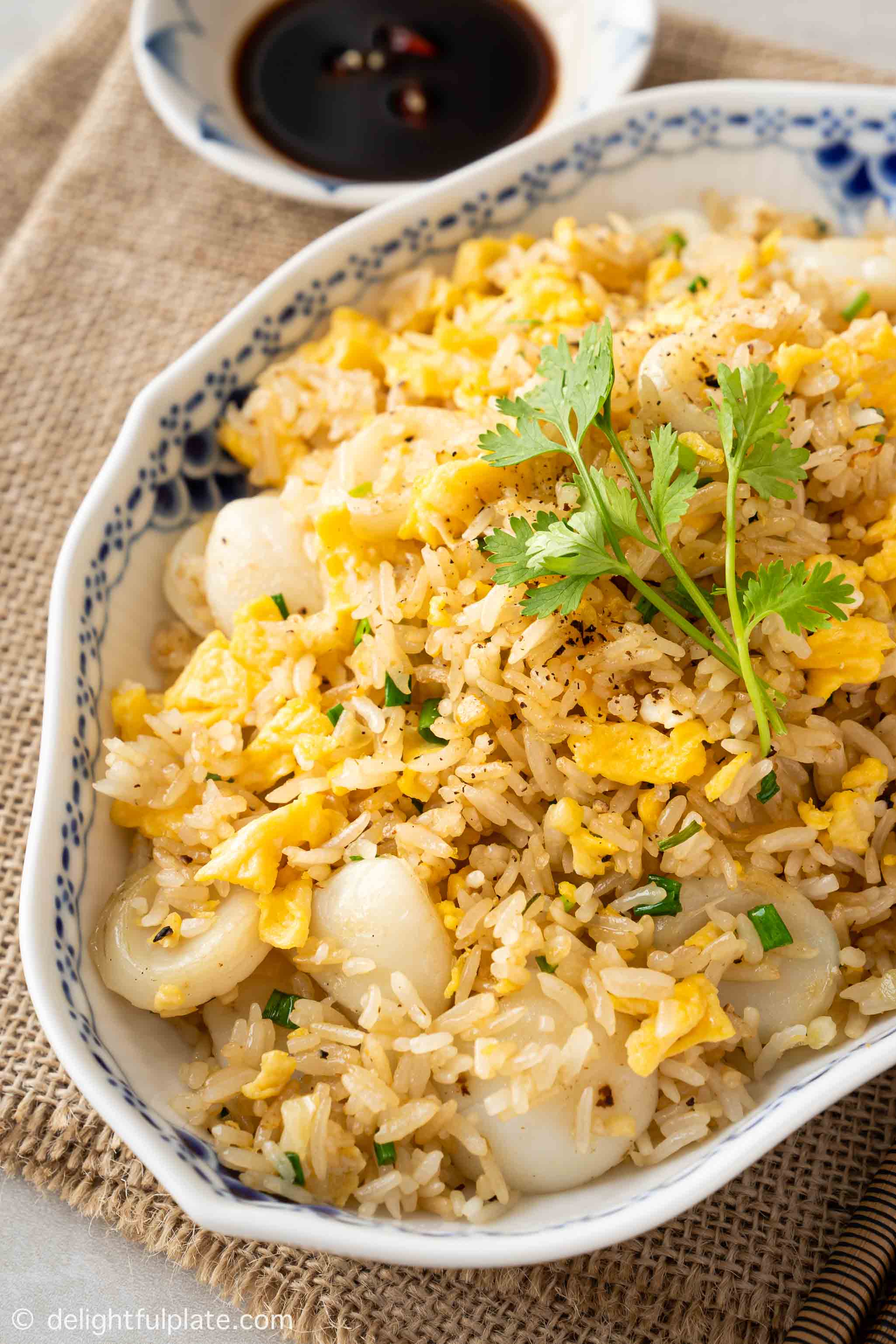 a plate of scallop fried rice