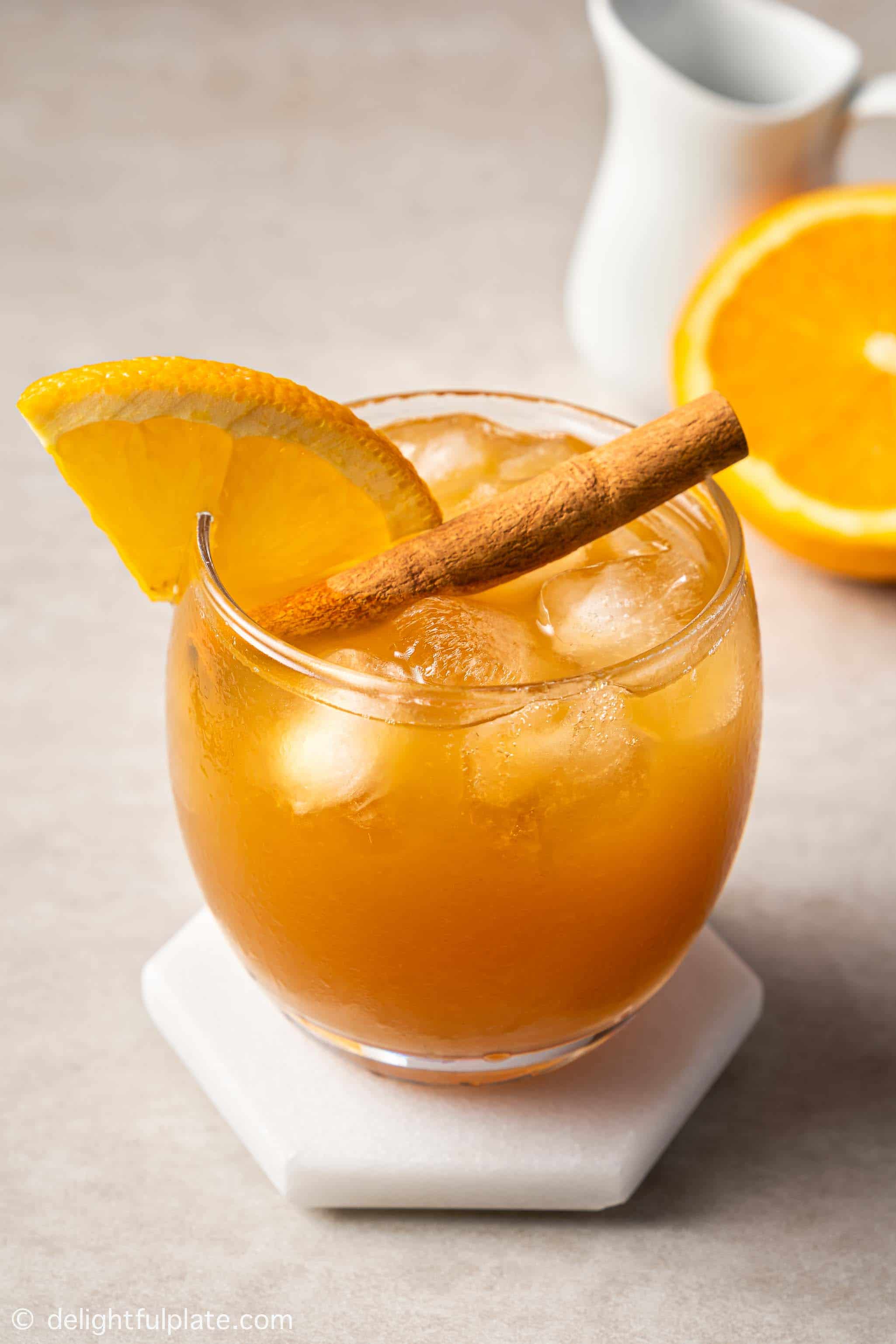 a glass of orange cinnamon iced tea