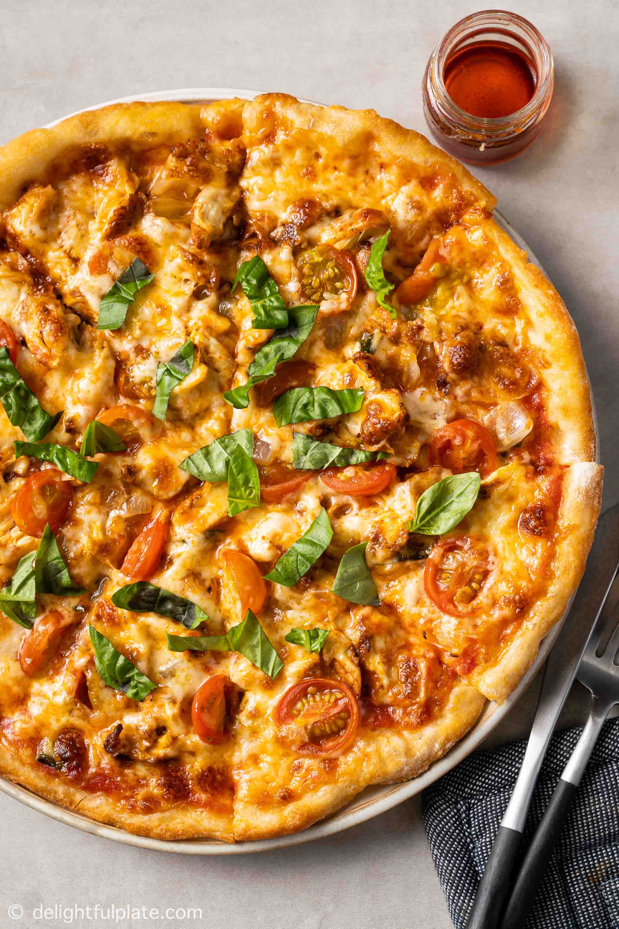 a paprika chicken pizza on a plate