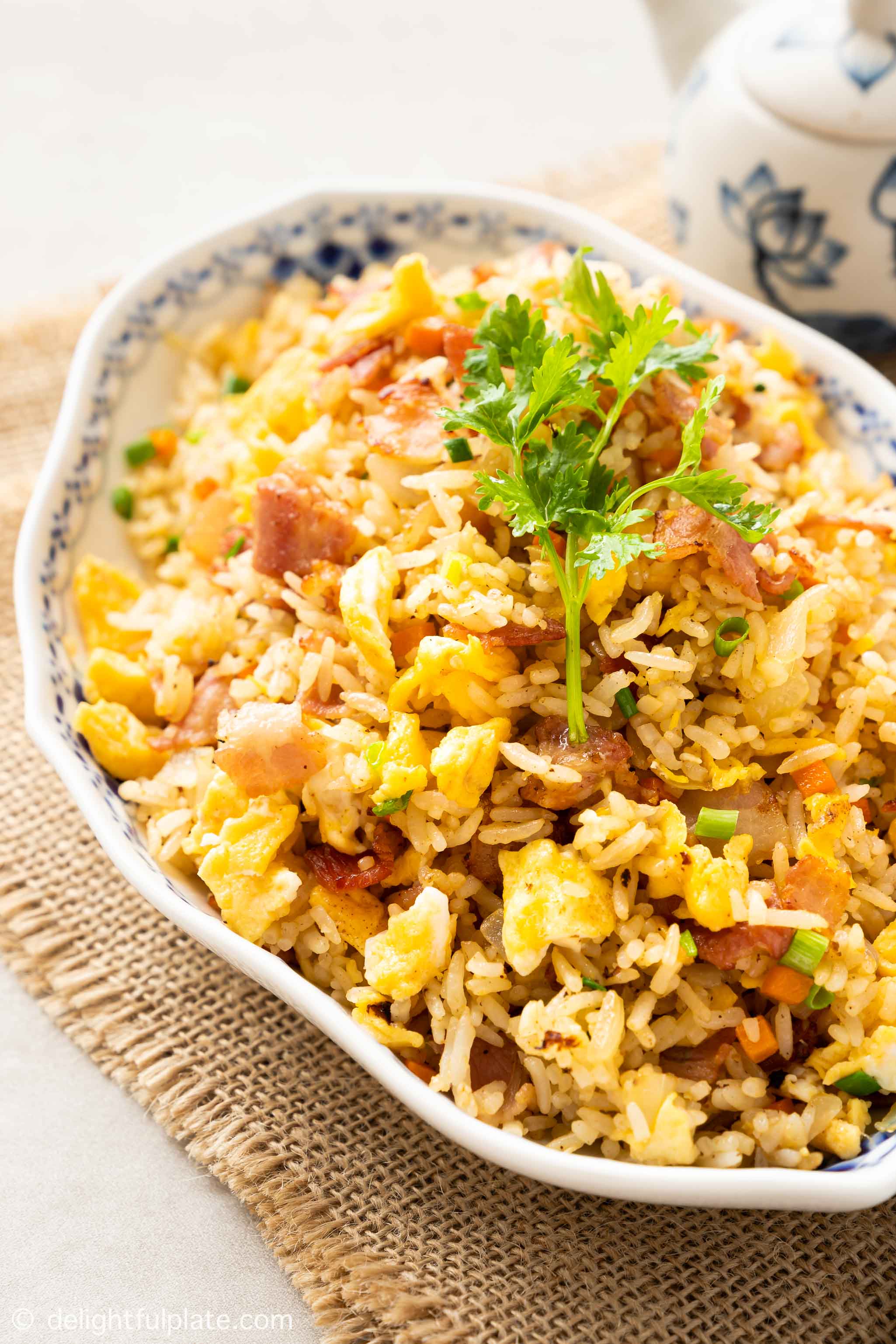 a plate of bacon fried rice