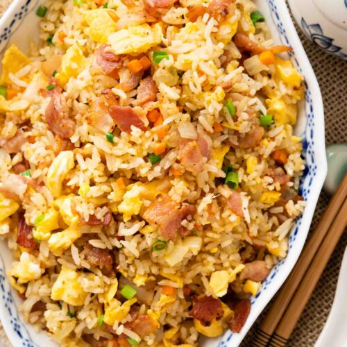 a plate of bacon fried rice