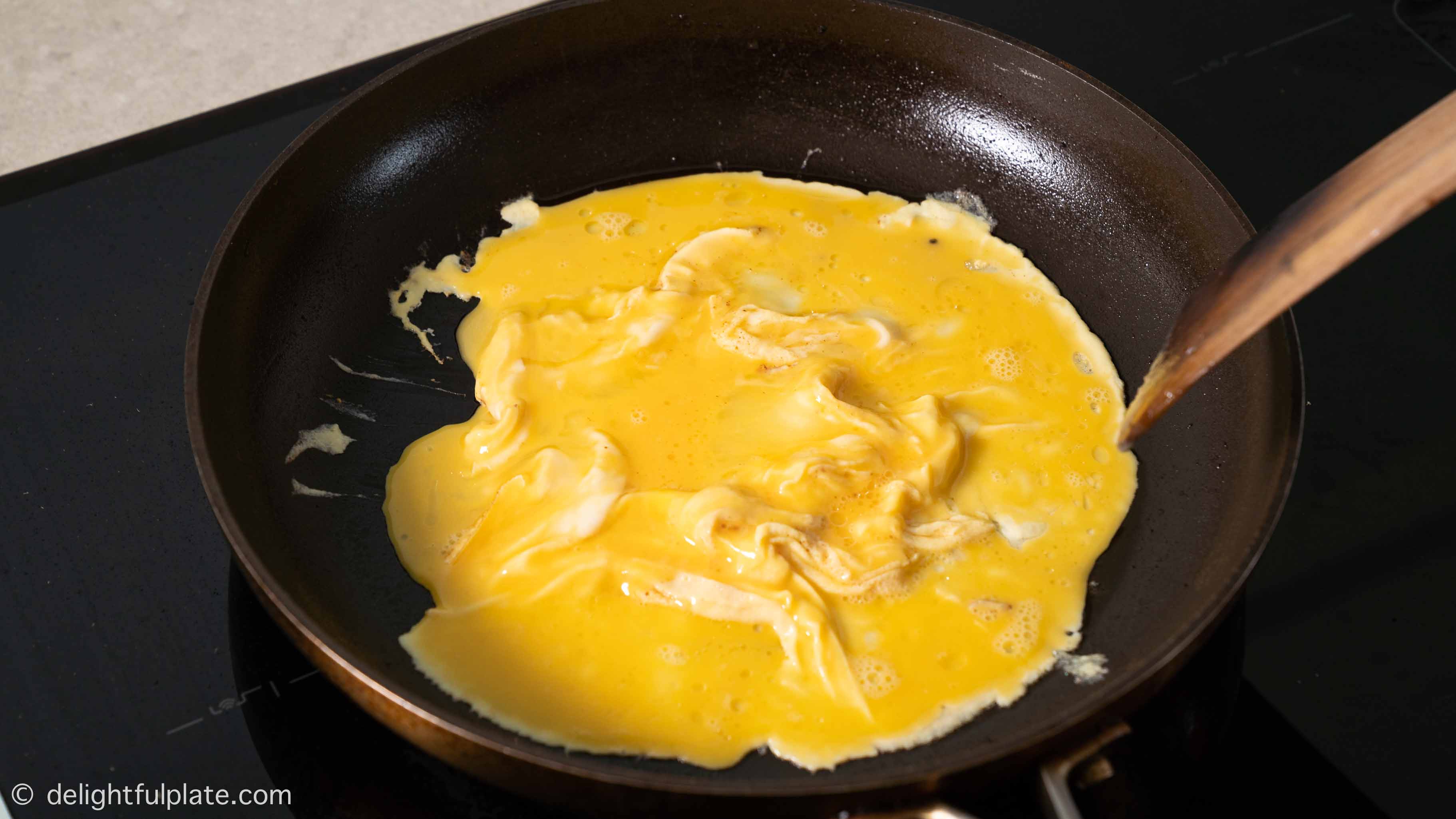 scrambling eggs in the pan