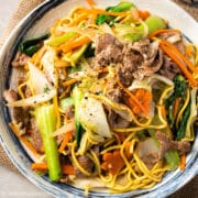 a plate of mi xao bo (beef noodle stir fry)