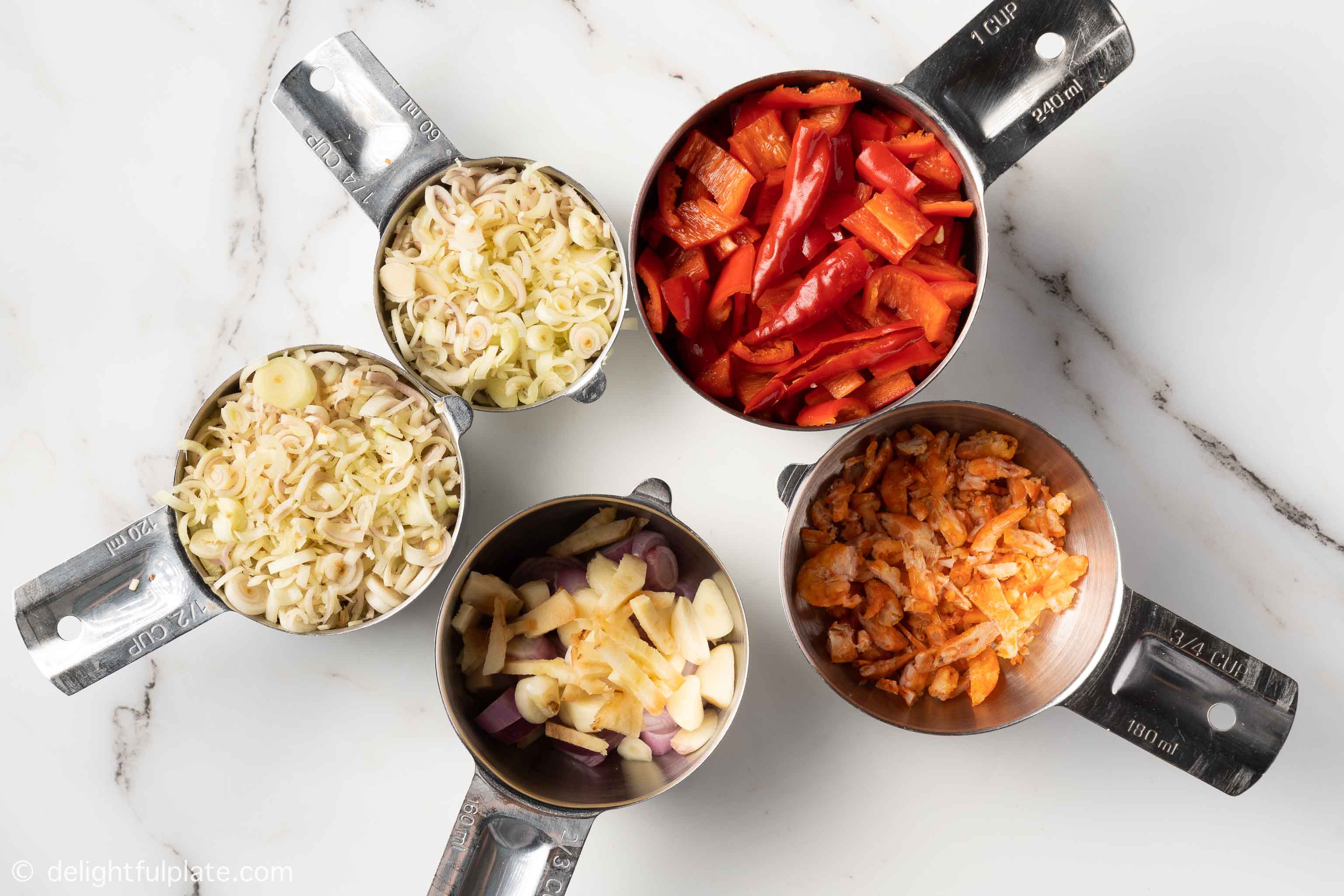 chopped ingredients in measuring cups