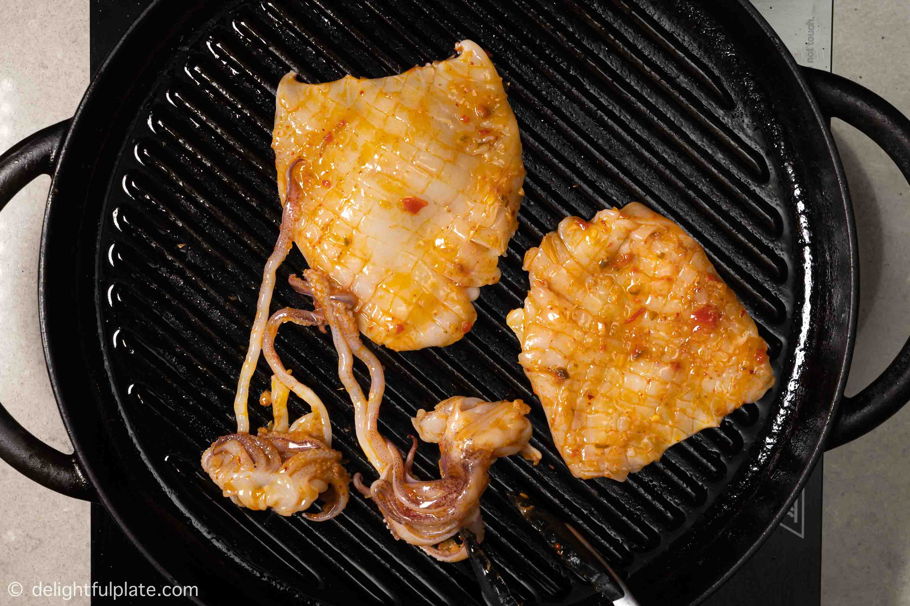 grilling squid on a grill pan