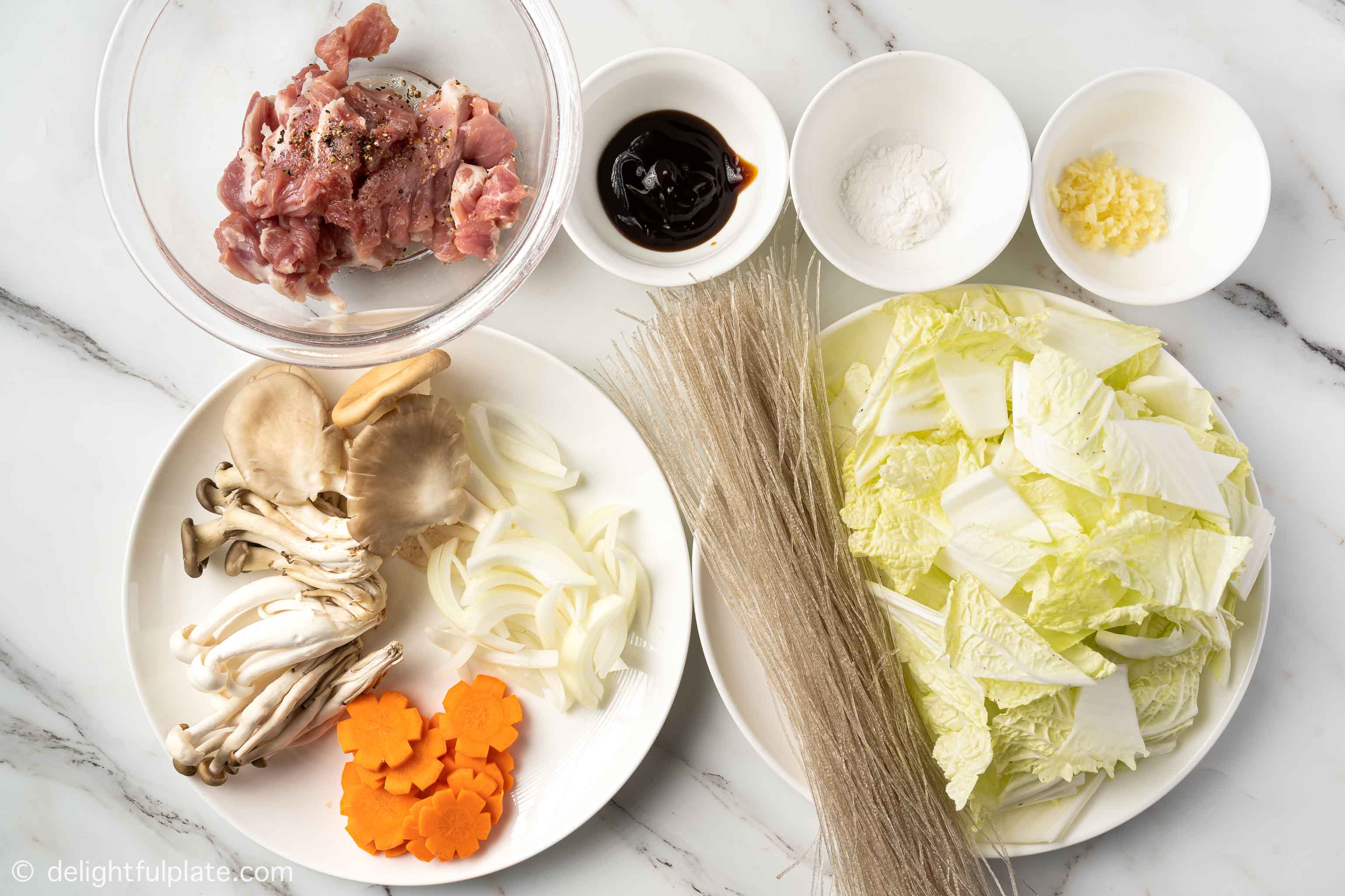 plates with ingredients for this braised glass noodles recipe