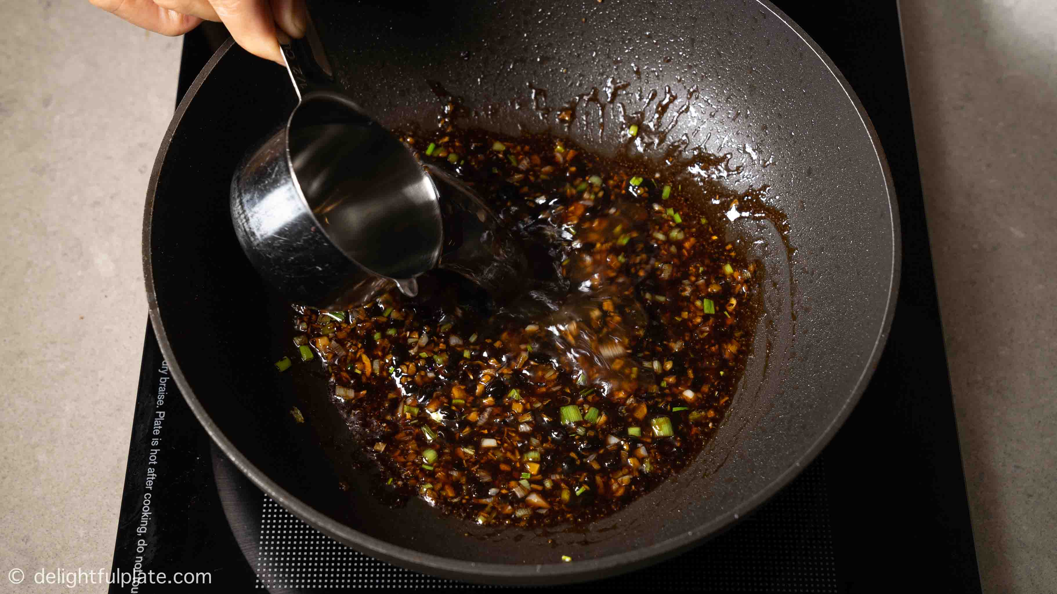 making the black bean sauce in a pan