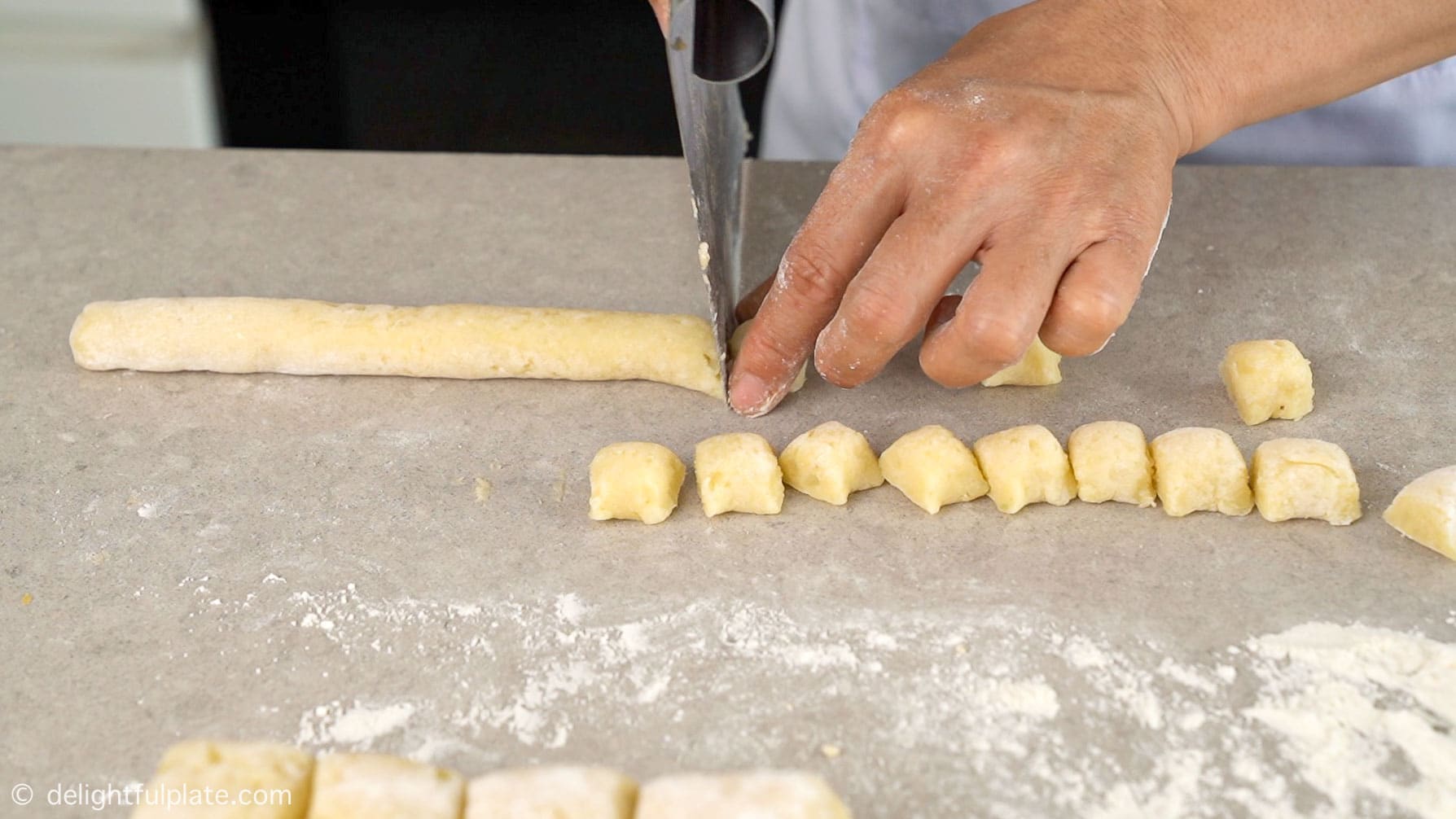 cutting the dough into gnocchi
