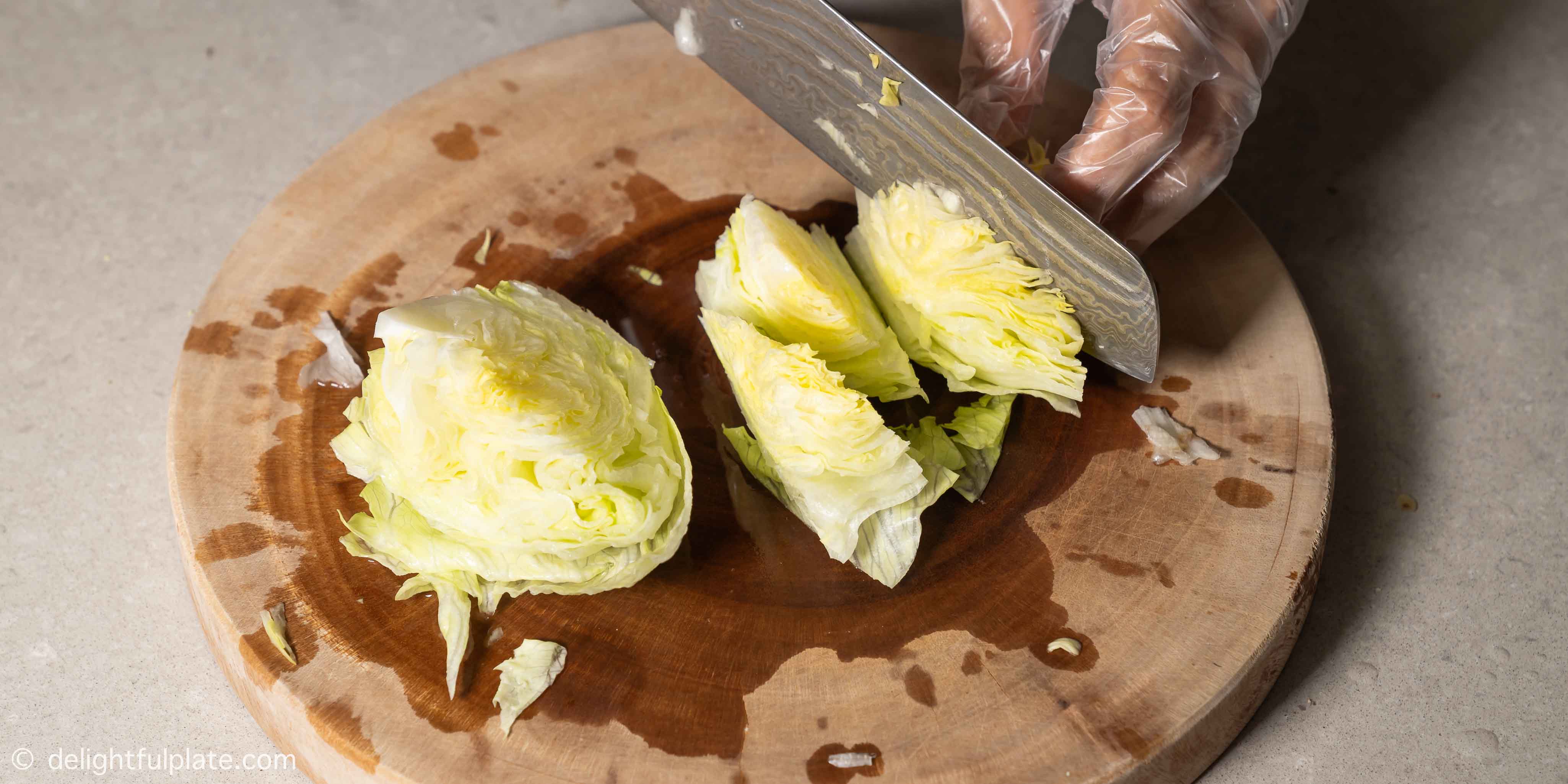 cutting iceberg lettuce into small pieces