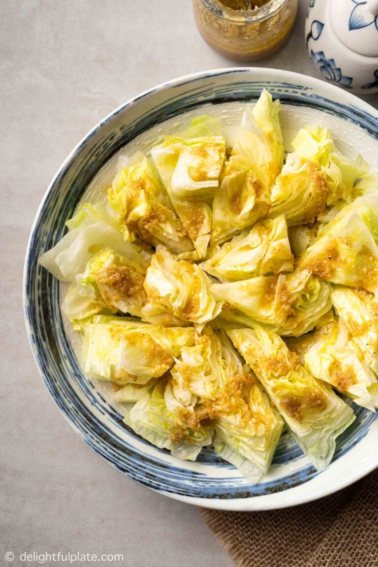 a plate of iceberg lettuce salad with ginger dressing