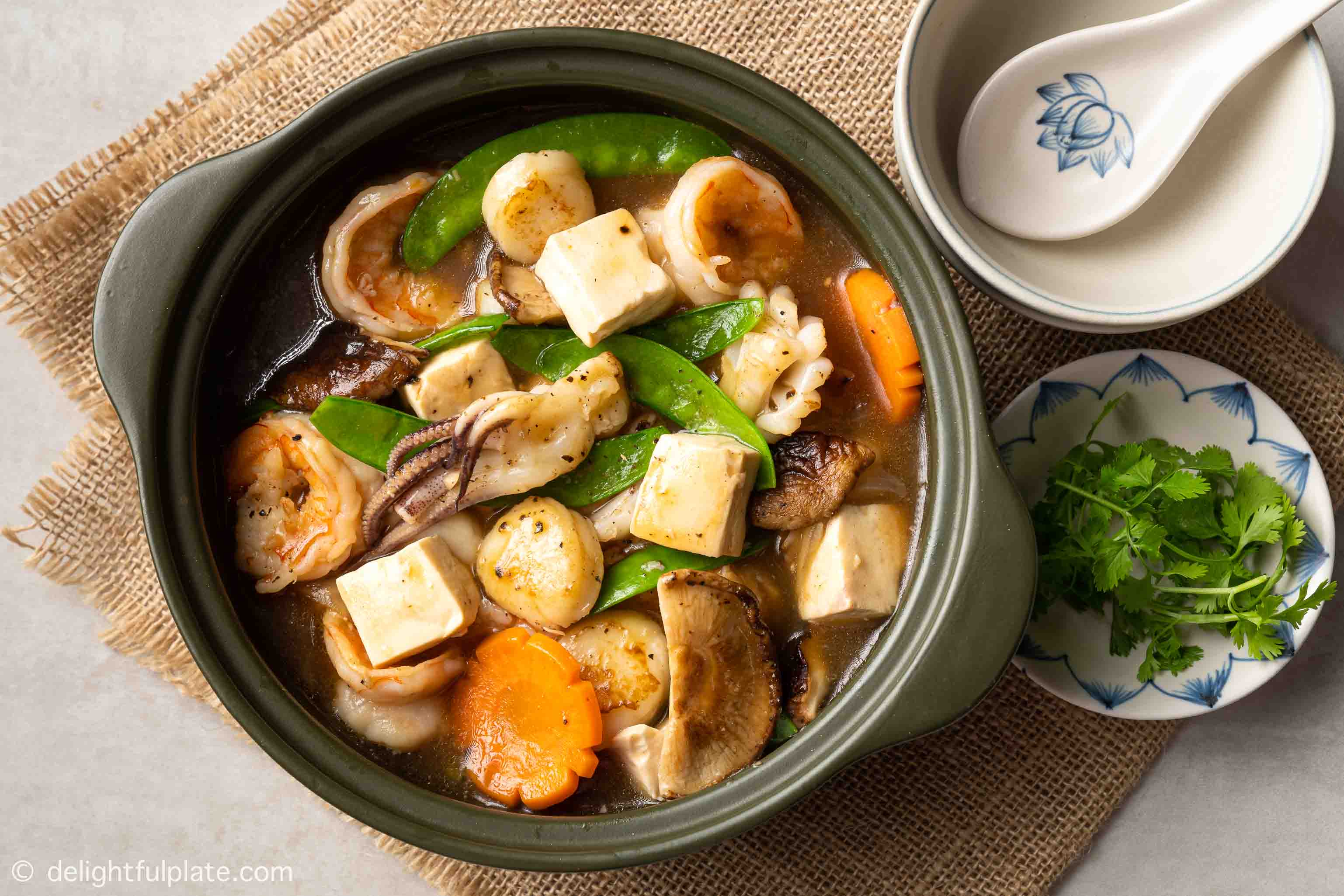 a clay pot of seafood tofu stew