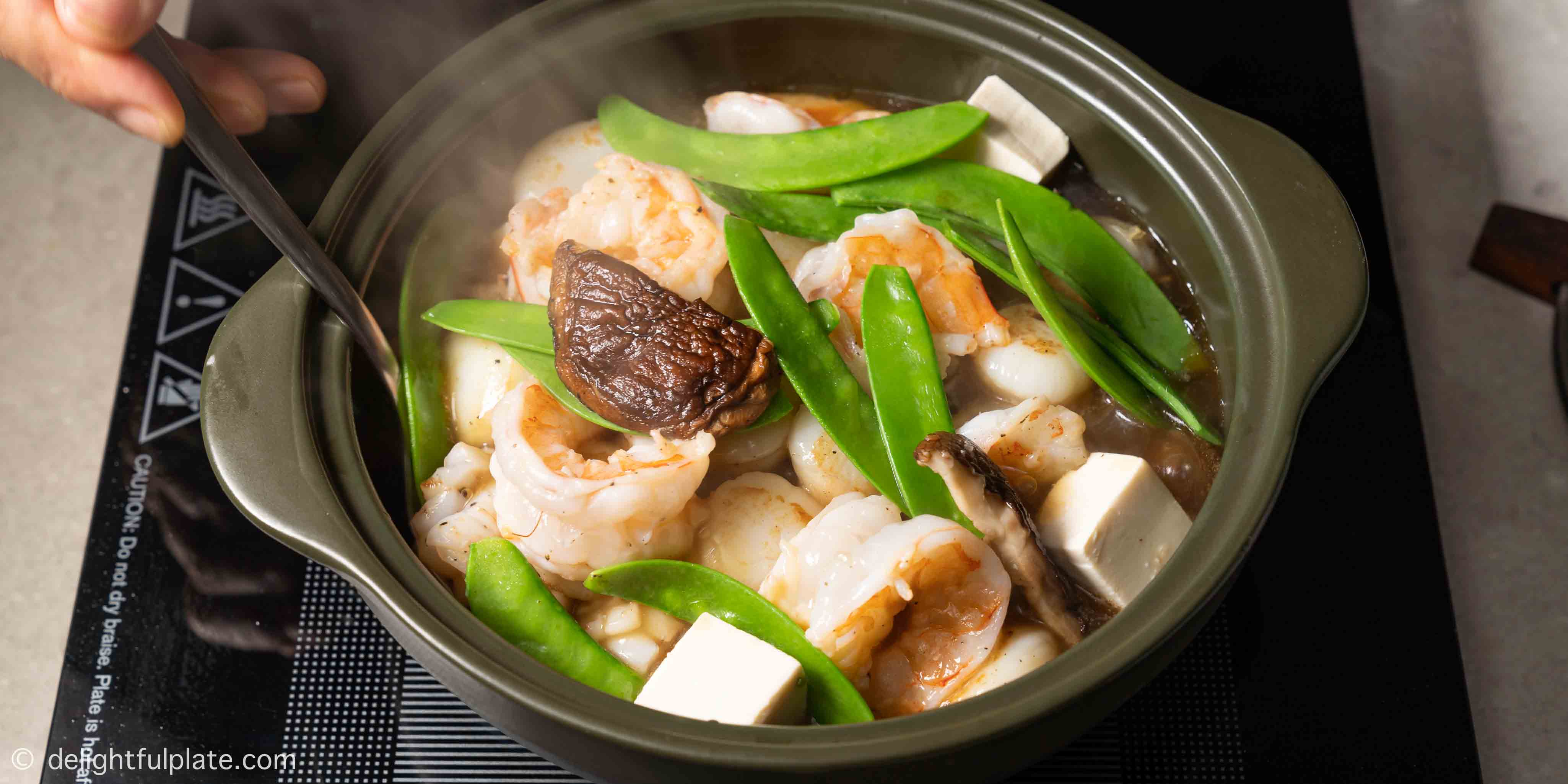 piping hot pot of seafood tofu casserole