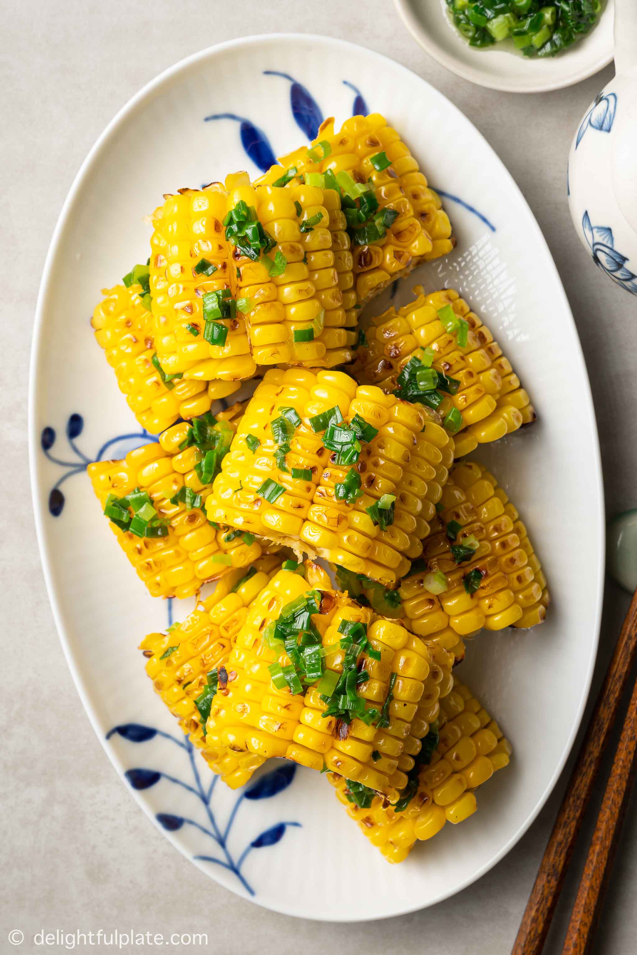 a plate of Vietnamese grilled corn with scallion oil