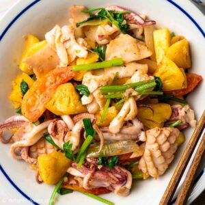 a plate of Vietnamese stir-fried squid with pineapple