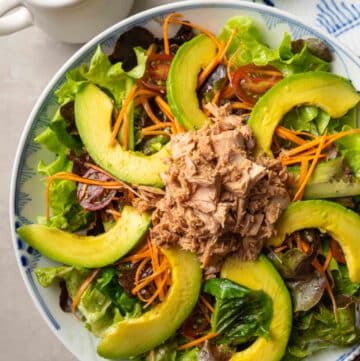 a plate of avocado tuna salad with soy sauce dressing