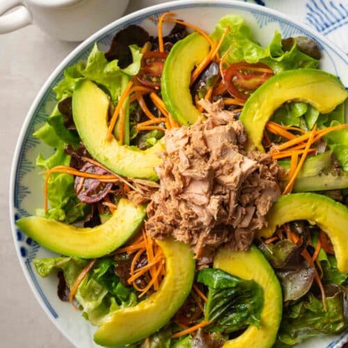 a plate of avocado tuna salad with soy sauce dressing