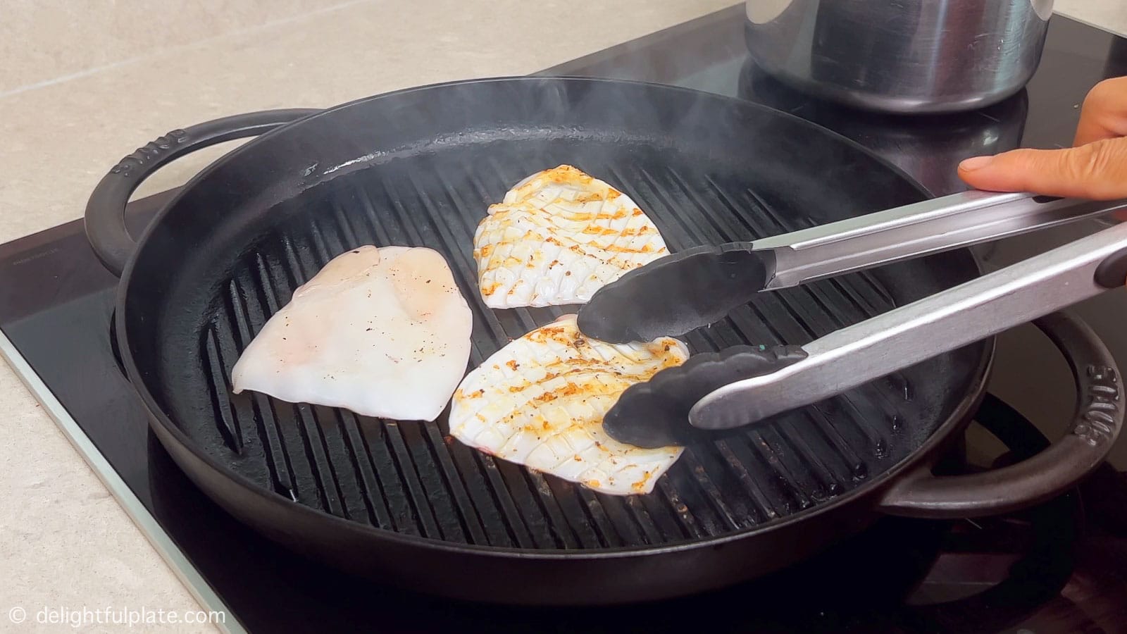 grilling squid in a grill pan
