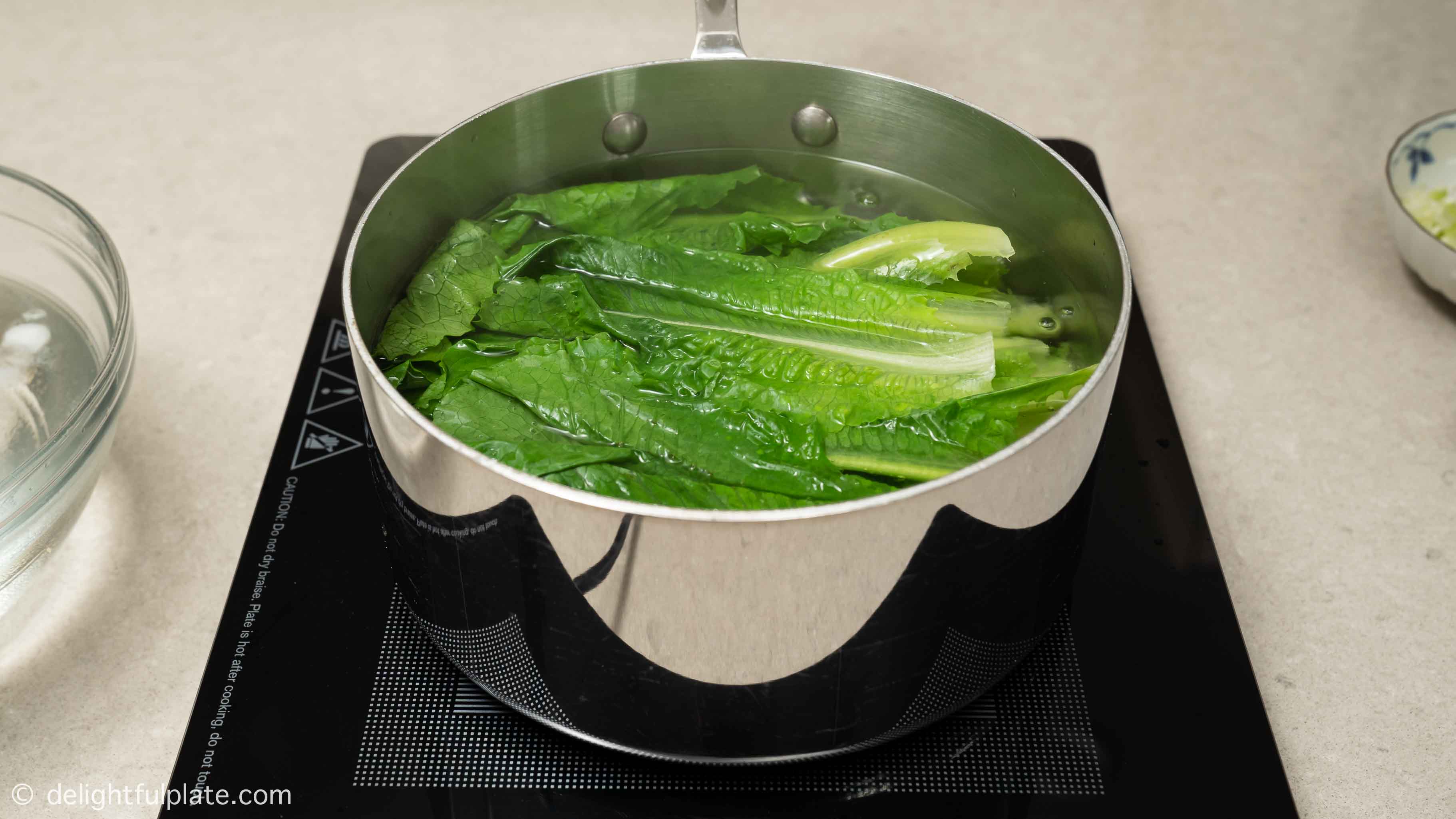 blanching lettuce in a large pot