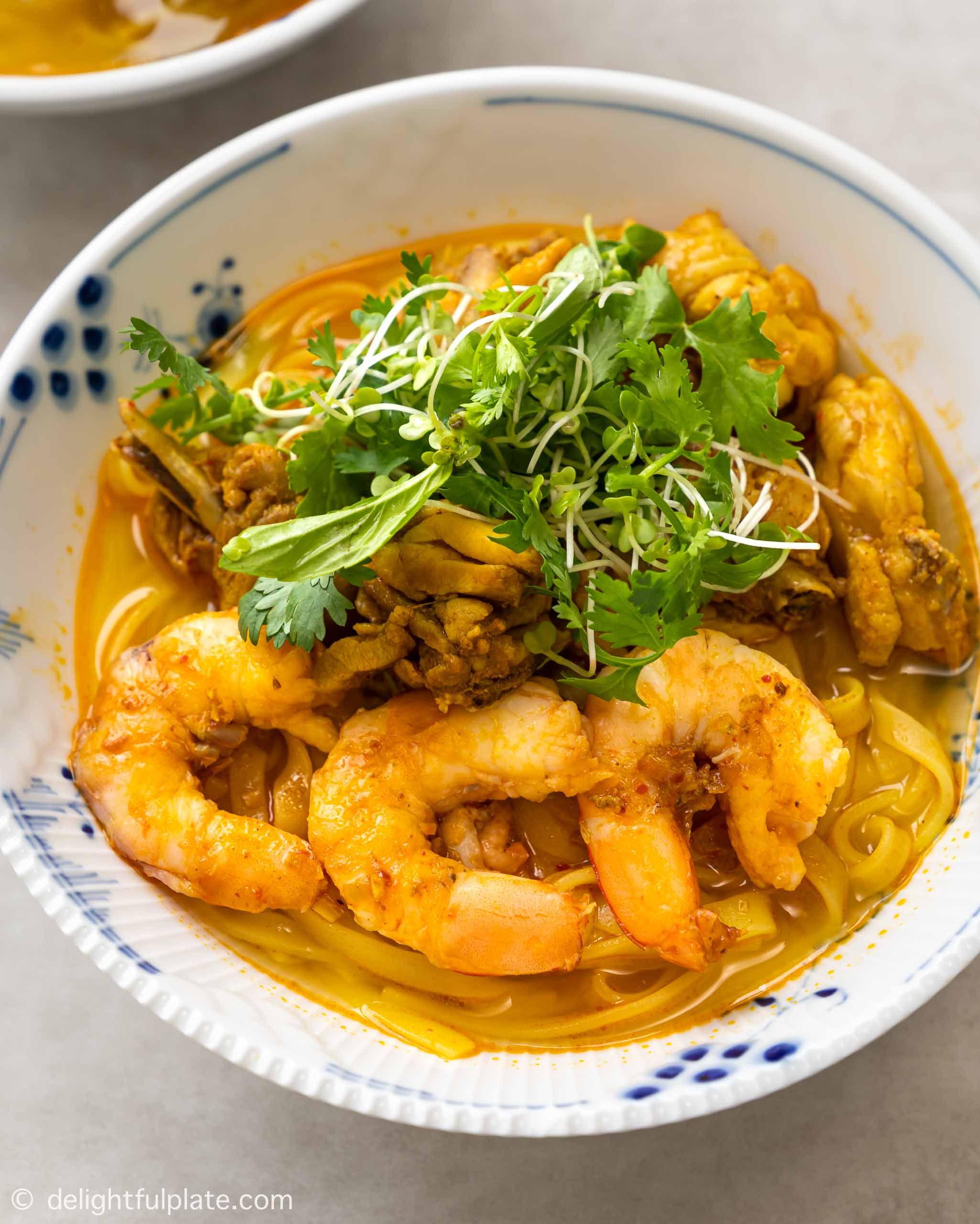 a bowl of Vietnamese Quang style noodle with shrimp