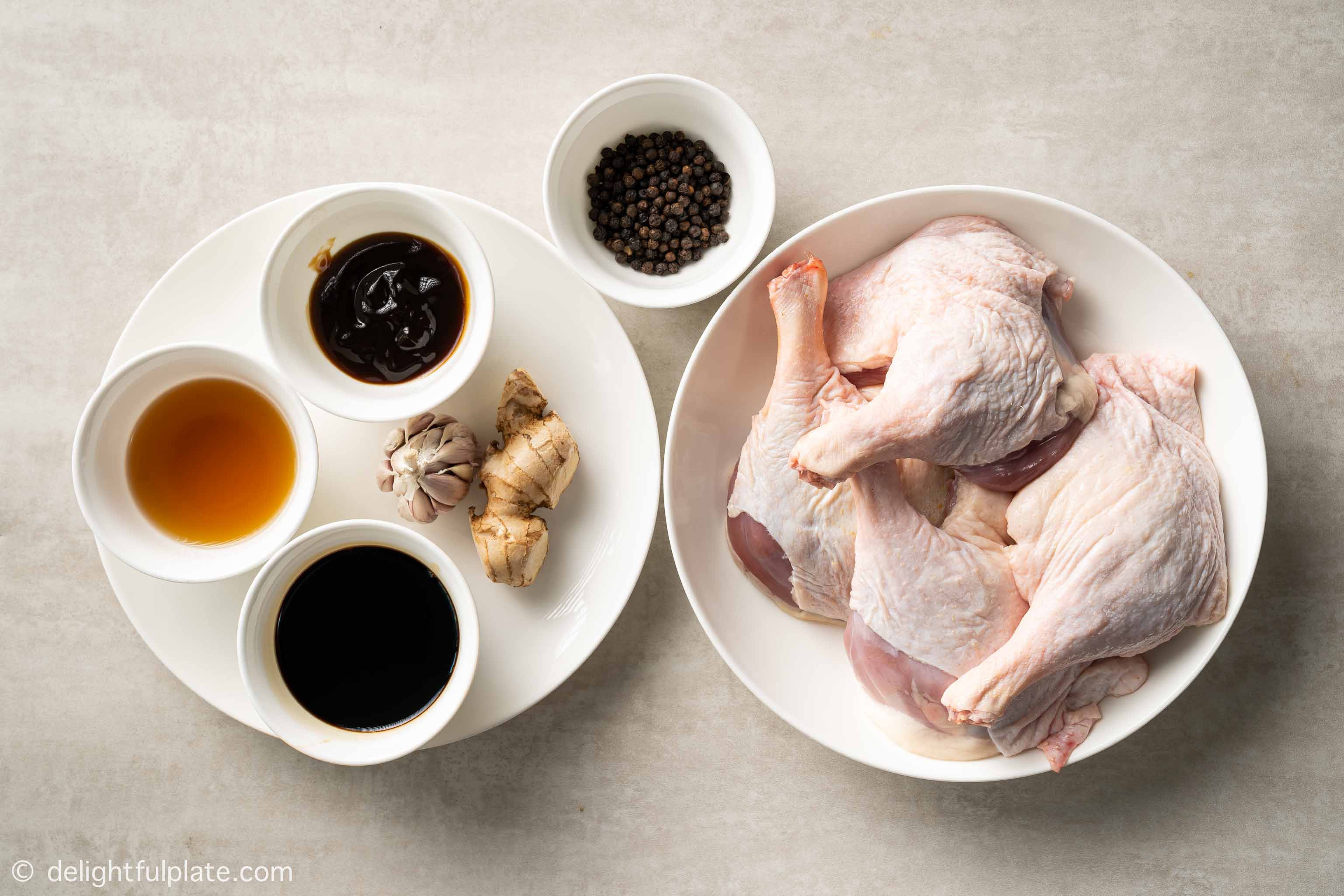 plates and bowls containing ingredients for this roasted duck legs recipe