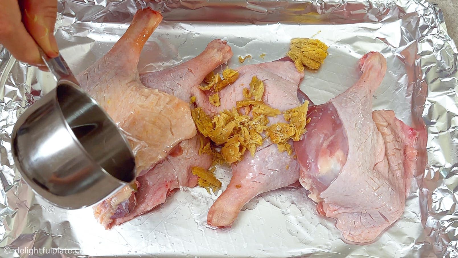 rubbing duck legs with ginger, salt and wine