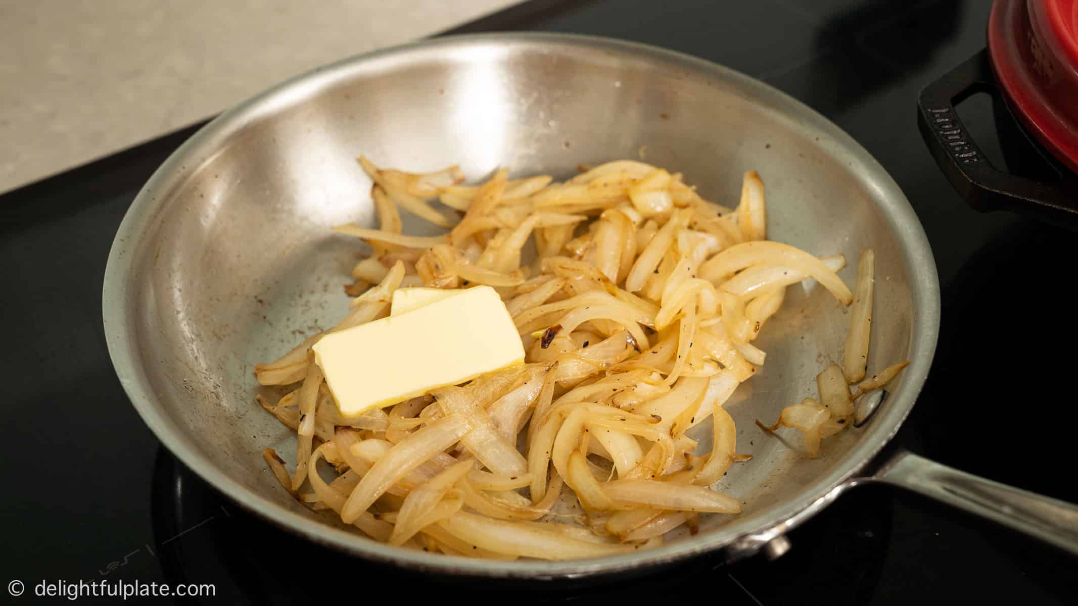 cooking onion slices in the skillet