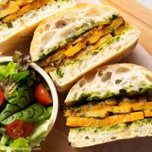 a plate of roasted butternut squash sandwiches with pesto