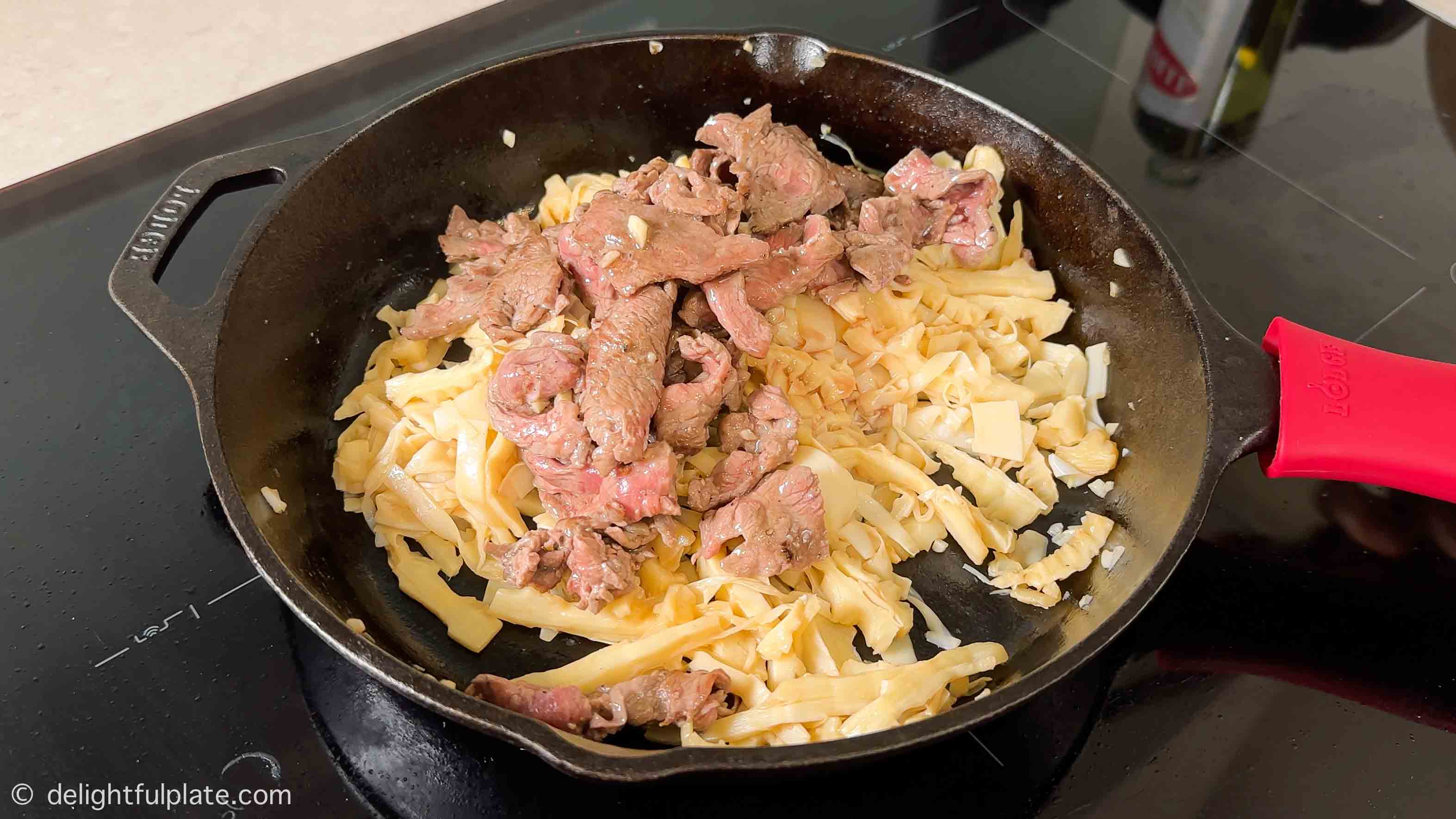 add beef back to the pan with the bamboo shoots