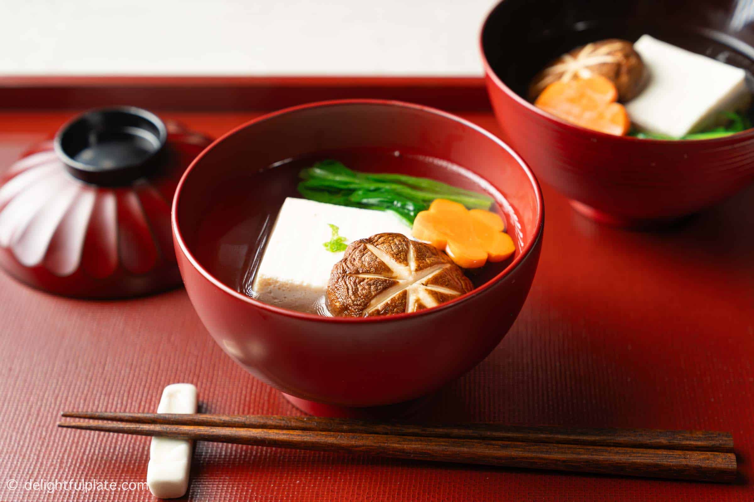 two bowl of suimono soups on a tray.