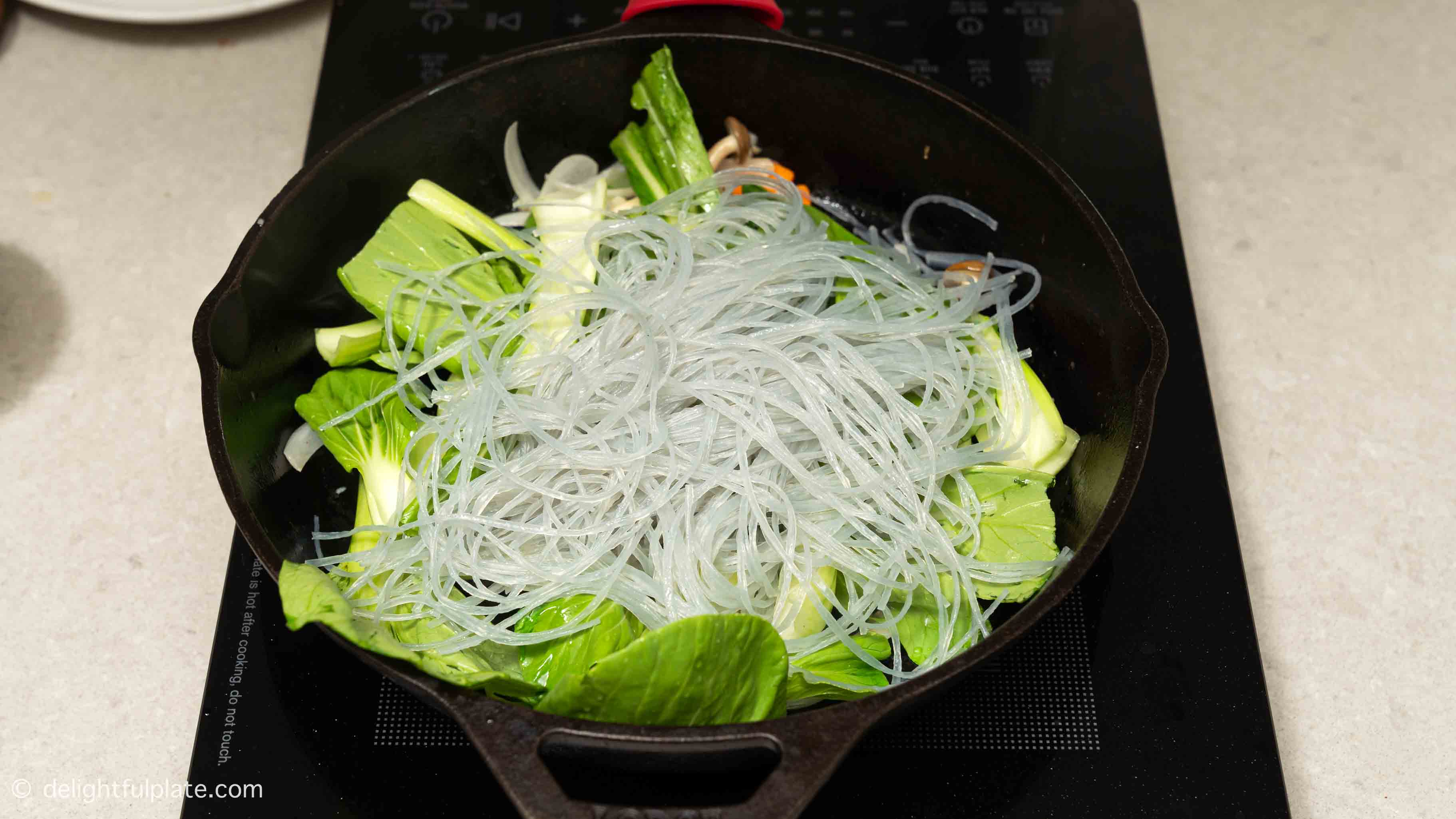 add glass noodles to the skillet.