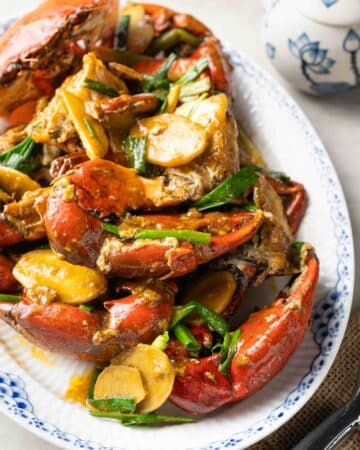 a plate of Vietnamese stir-fried crab with ginger and scallion (cua xao hanh gung).