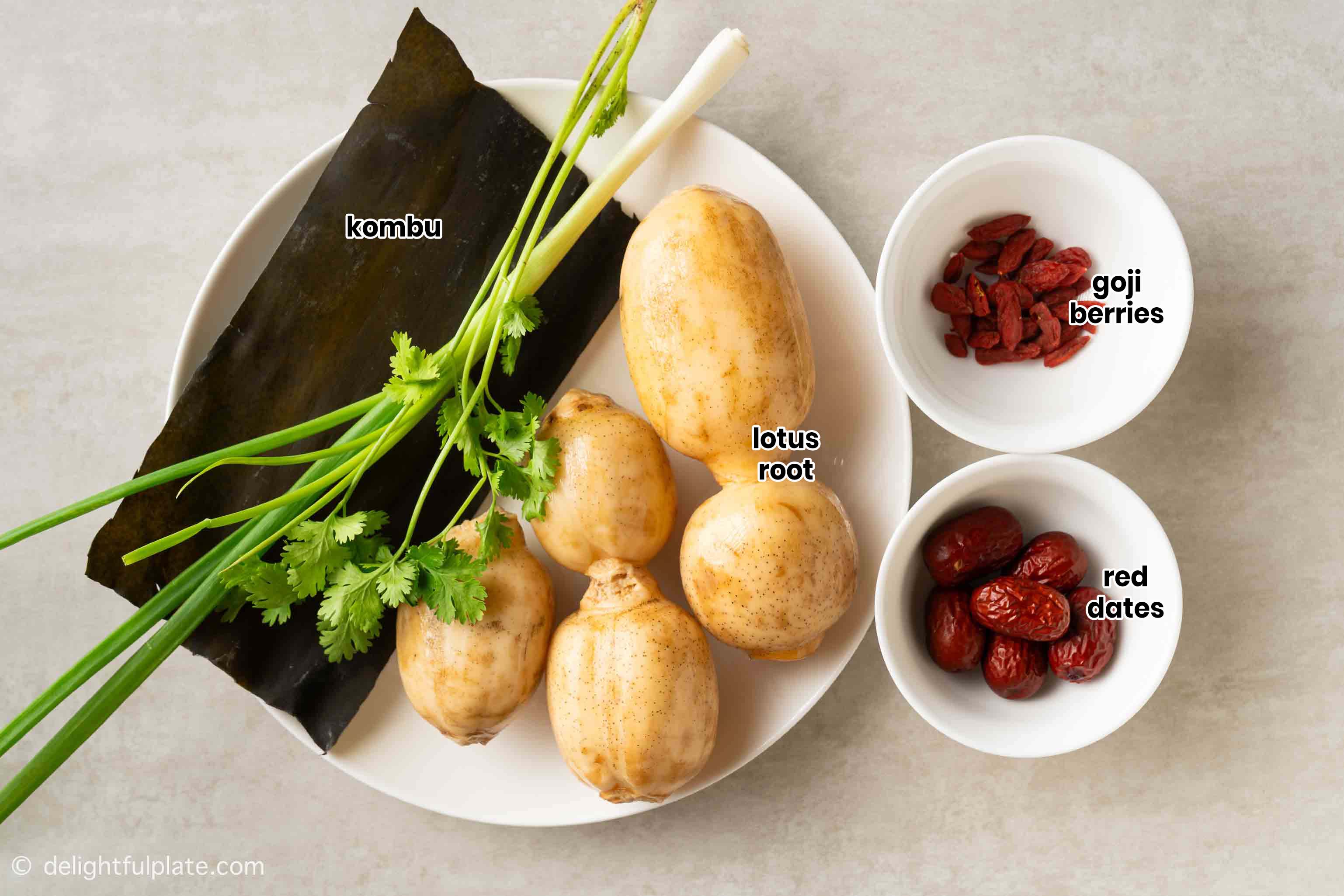 plates containing ingredients to make this Asian vegan lotus root soup.