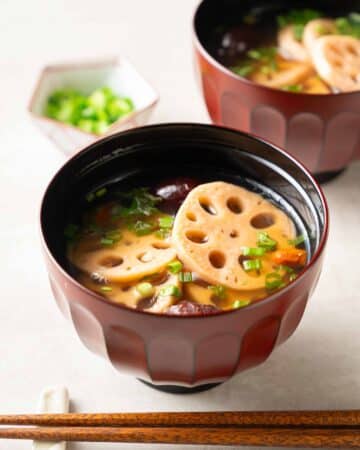 a bowl of lotus root soup with goji berries and red dates