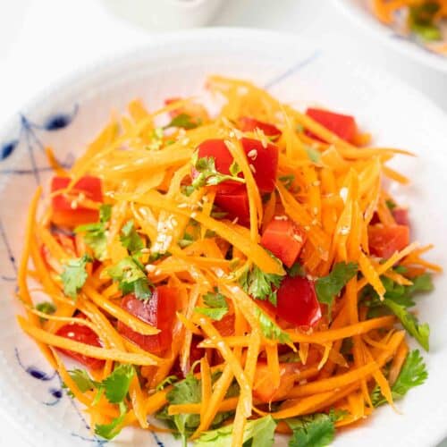 a plate of Asian Carrot Salad on the dining table.
