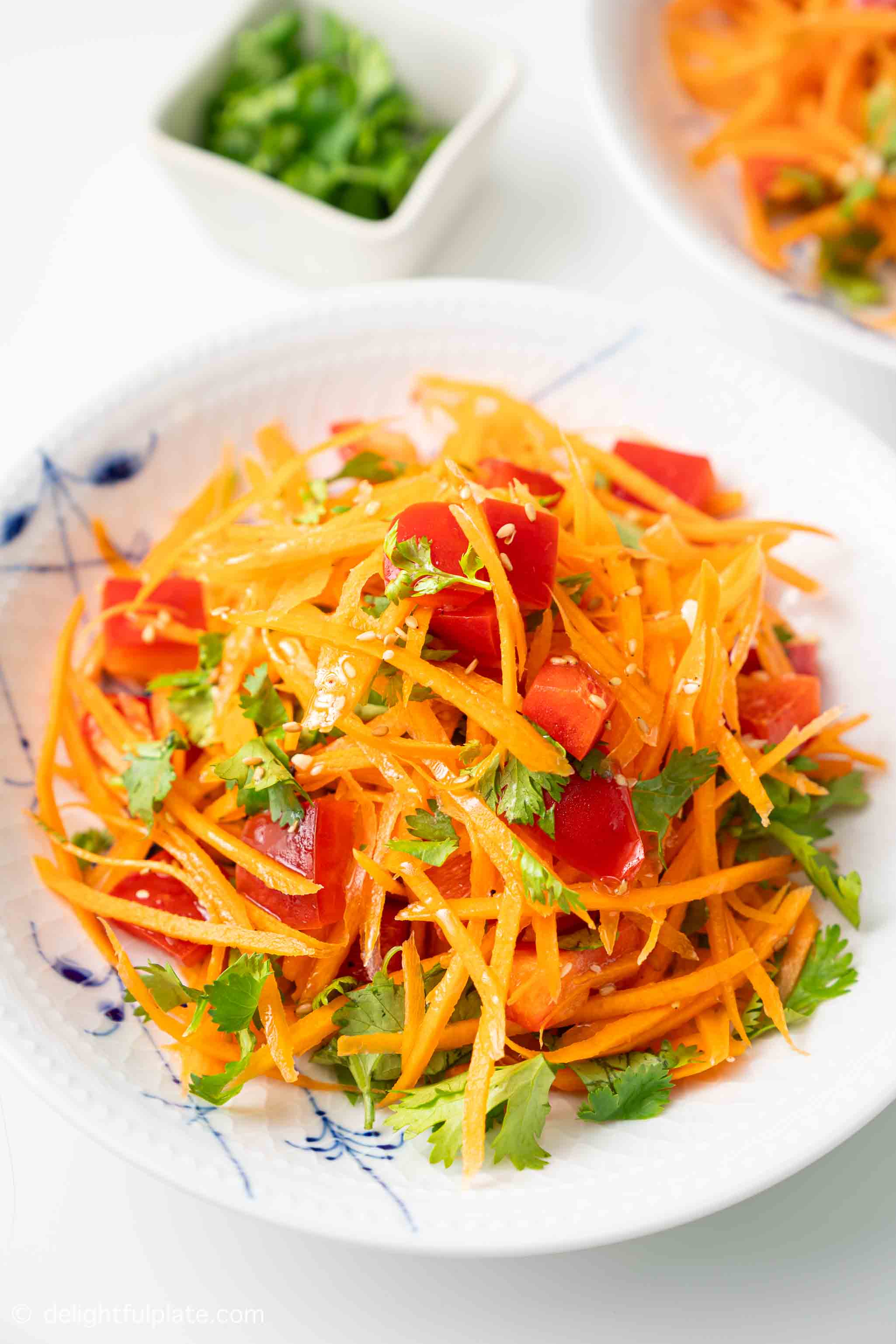 a plate of Asian Carrot Salad on the dining table.