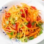 a plate of Asian Carrot Salad with a simple and tangy dressing.