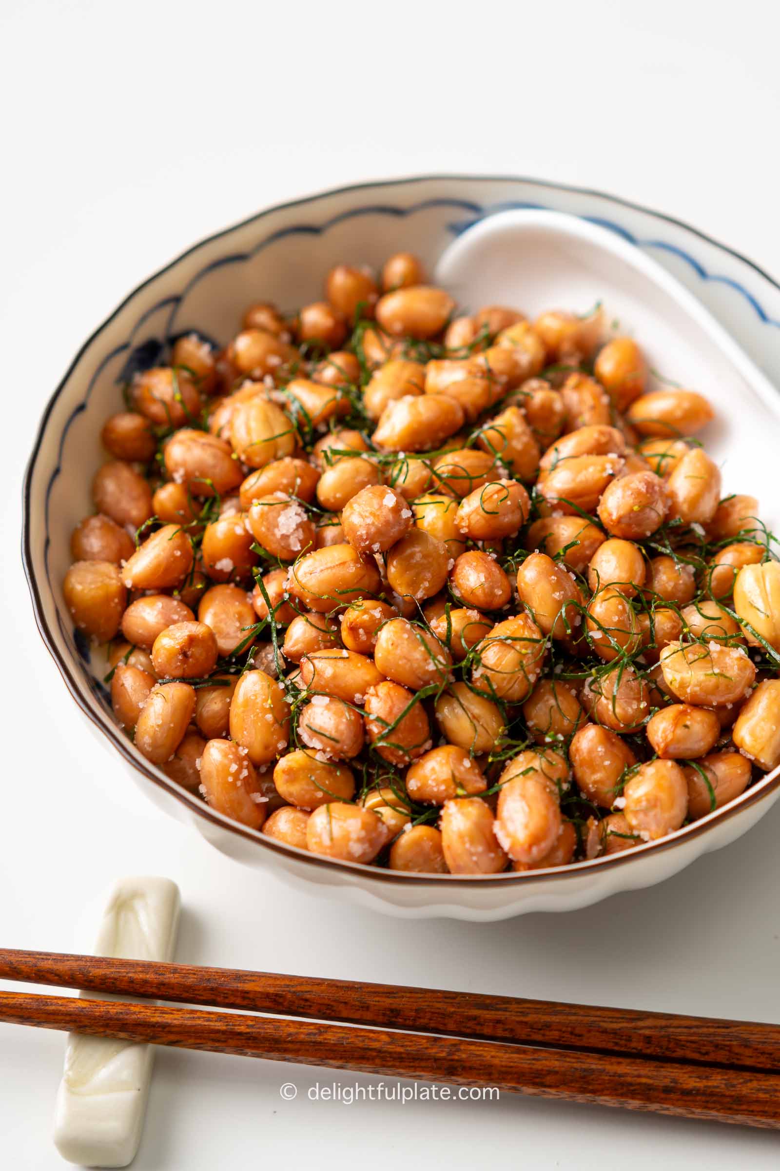 a bowl of salted fried peanuts.