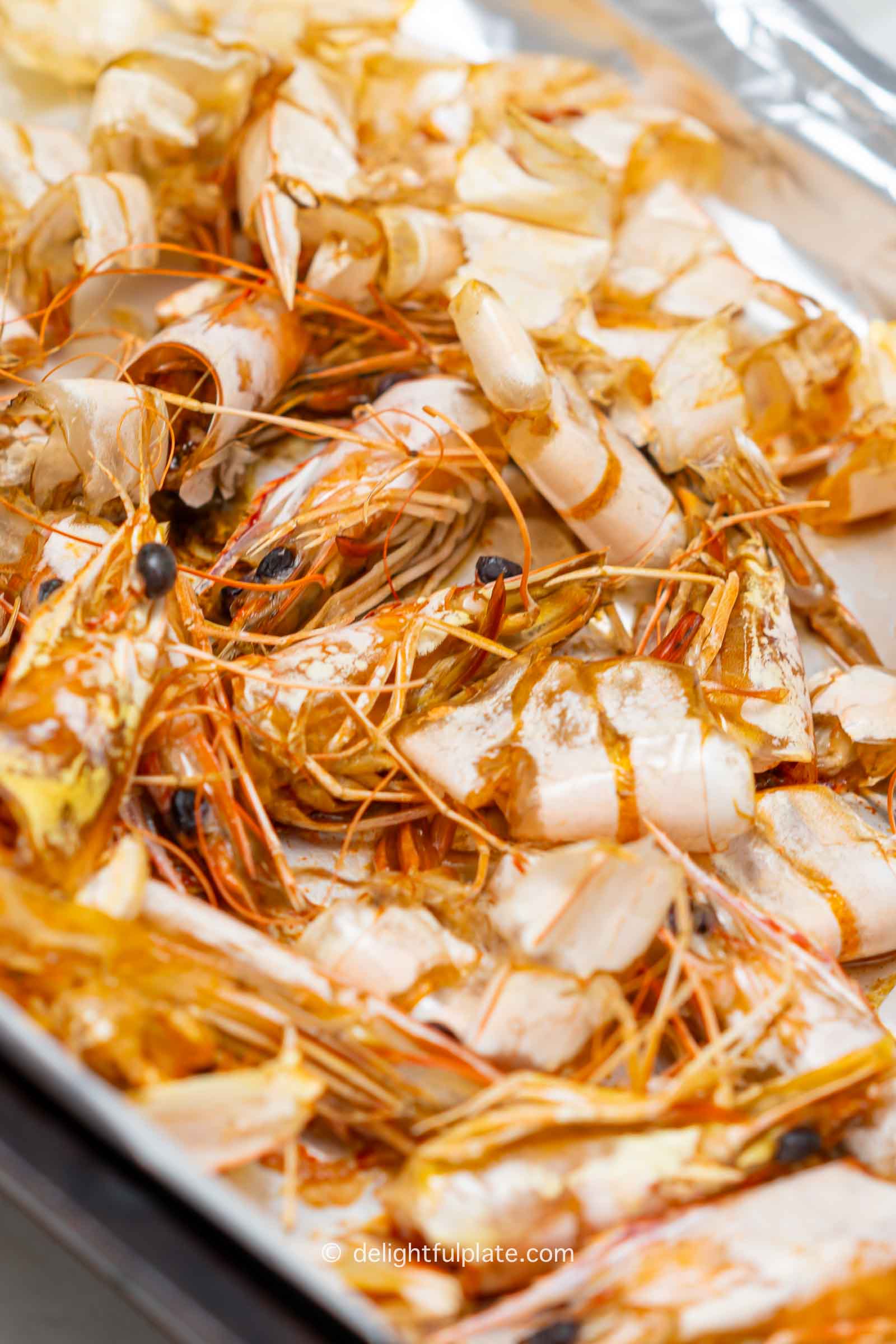 a tray of roasted shrimp shells and heads for the stock.
