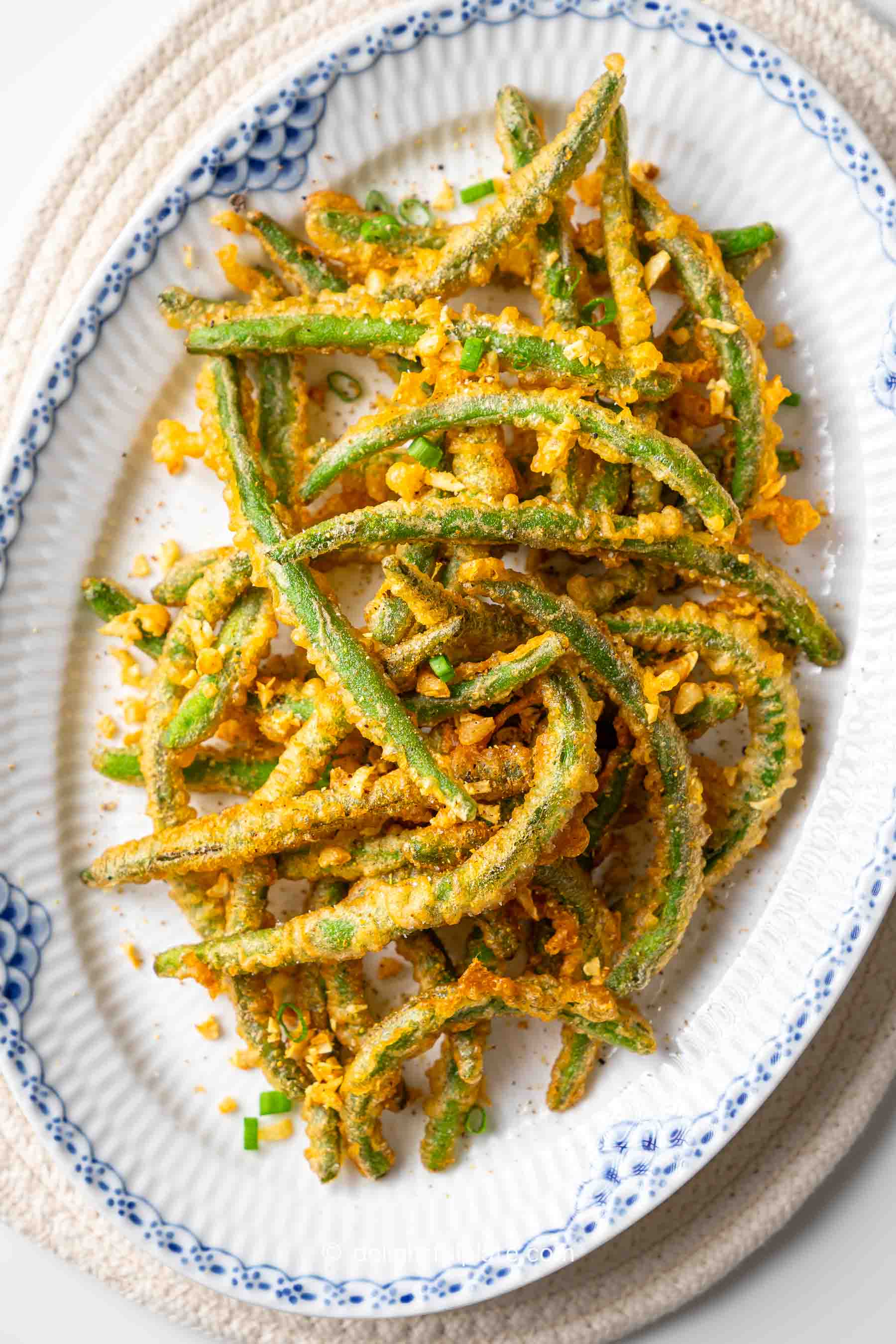 a plate of crispy fried green beans.