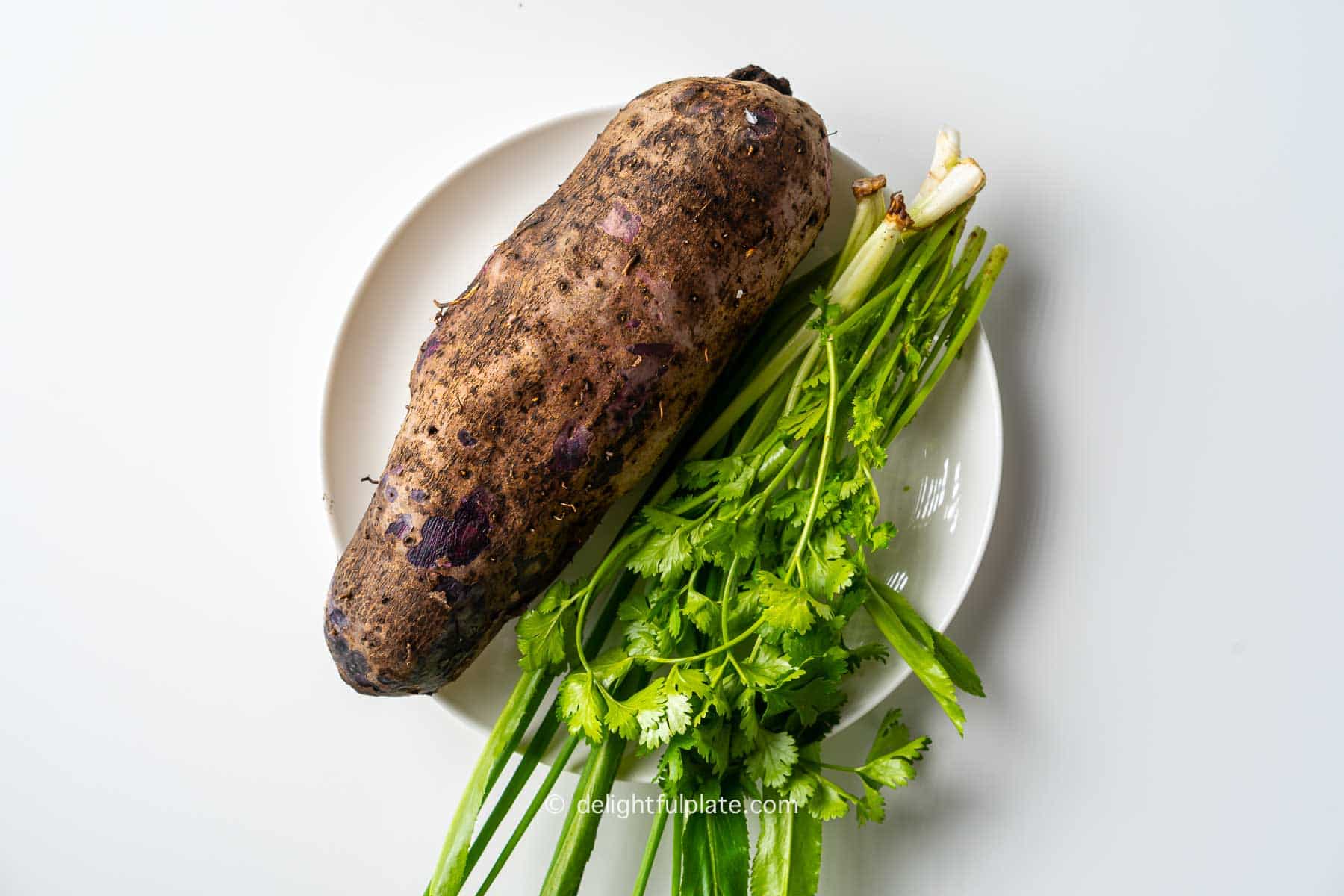 a purple yam on a plate.