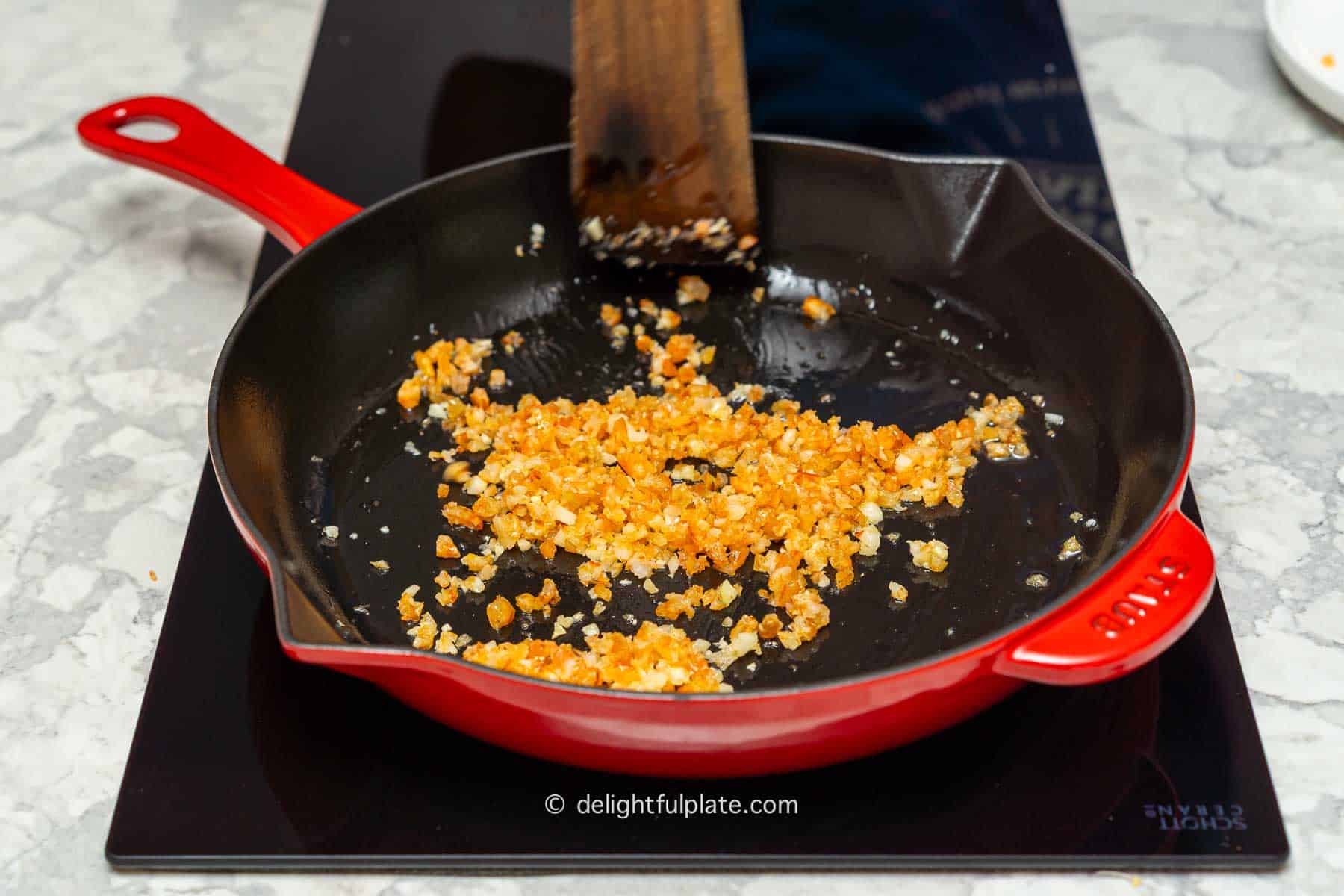 sauté chopped dried shrimp with garlic in a pan